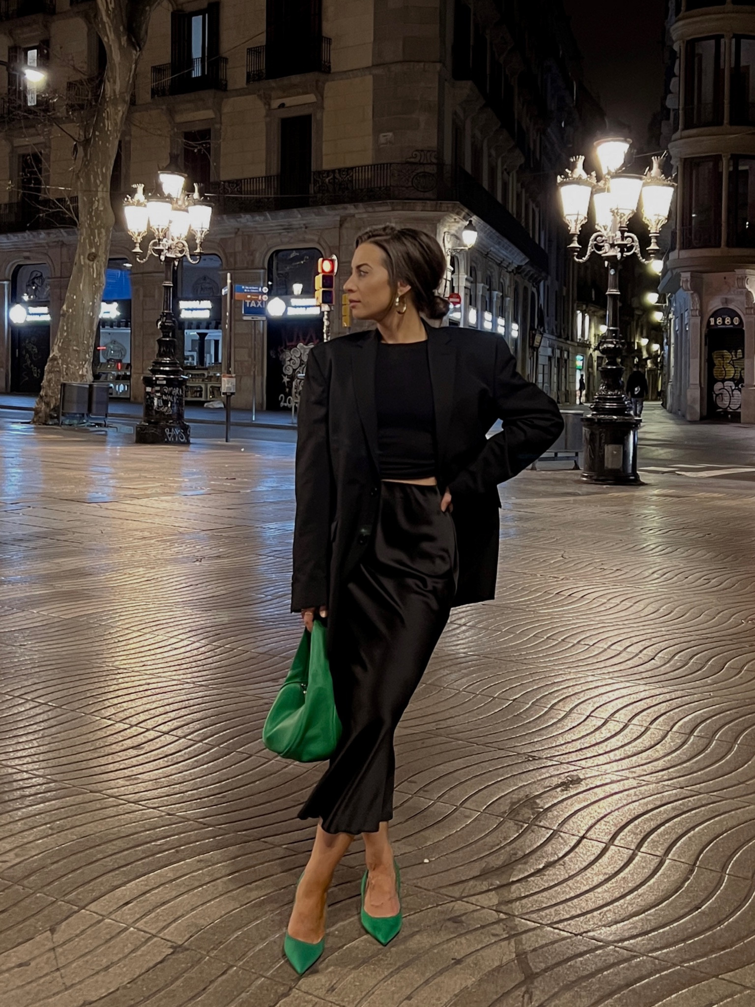 All black outfit for a night out in Barcelona. Black satin midi skirt. Black oversized blazer. Green heels. European style outfit. OOTN. Date night outfit style. Chic and classy outfit style. 

#LTKshoecrush #LTKeurope #LTKstyletip