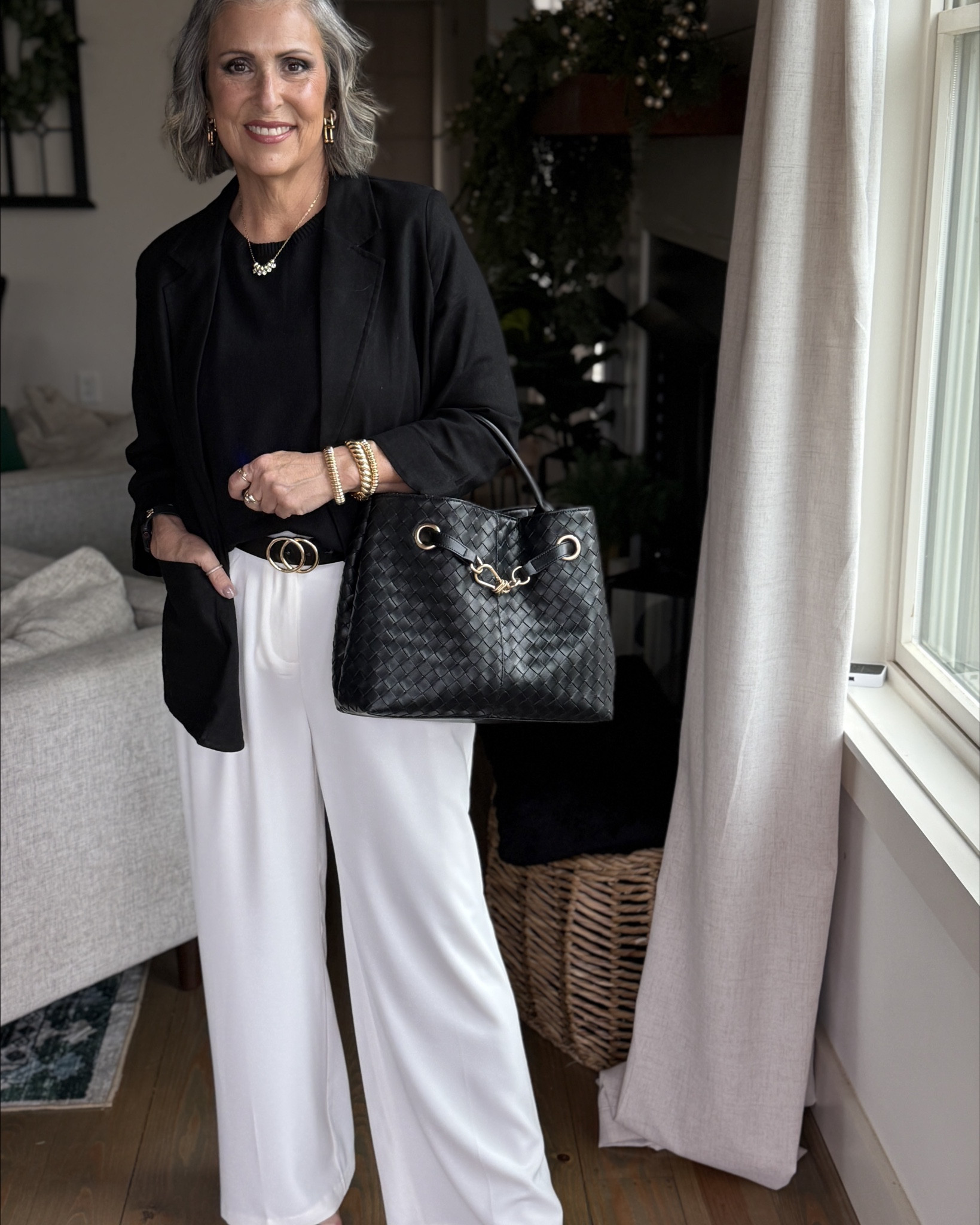 🖤 Look 3 – Office Workwear
	•	Black linen blazer (Walmart)
	•	Black woven satchel purse (Walmart)
	•	Black heeled sandals (Amazon)

This style story works because it starts with a confident, flattering black-and-white base that allows endless versatility. The sleeveless sweater offers structure and breathability, while the wide-leg white pants provide movement and polish. Each added piece – from sneakers to heels, denim to blazer – transforms the look to meet the needs of your day. This approach simplifies getting dressed and builds a wardrobe that works as hard as you do. It’s stylish, intentional, and rooted in classic elements that will never go out of style.

#LTKStyleTip #LTKFindsUnder50 #LTKOver40