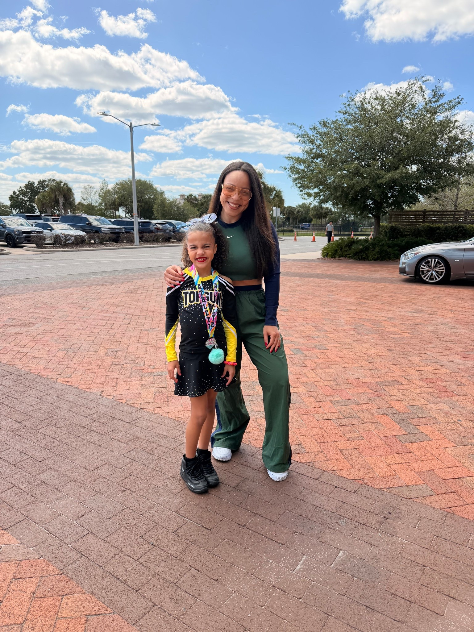 With our Top Gun cheerleading champ 📣🏆 Love this green and blue @Nike US set! I’m wearing a M top and S bottom. Originally ordered a M bottom and they were too big. Had to size down in this one. 

#athleisure #nikesets #nikeset #urbanwear

#LTKSaleAlert #LTKdayinmylife #LTKootd