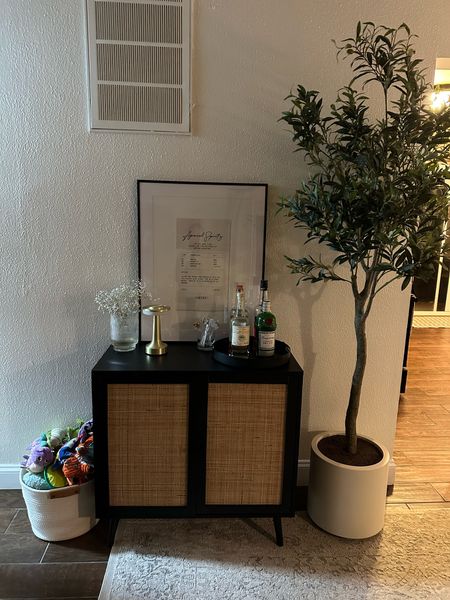 Faux olive tree is from Costco ($150, it’s such a great deal since it comes with the pot!). Home decor. Affordable home decor. Amazon finds. Amazon home finds. Bar cabinet. Bar cart. Art prints. Bar art. 

#LTKfindsunder100 #LTKfindsunder50 #LTKhome