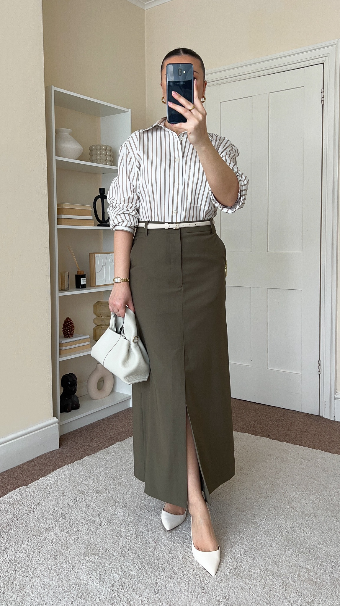 Smart, classic & chic Spring outfit. Skirt is from Arket, wearing size UK10. Shirt is from H&M, wearing size XS. Heels are from Mango. Handbag is from Polene Paris.

#LTKeurope #LTKfindsunder100 #LTKstyletip