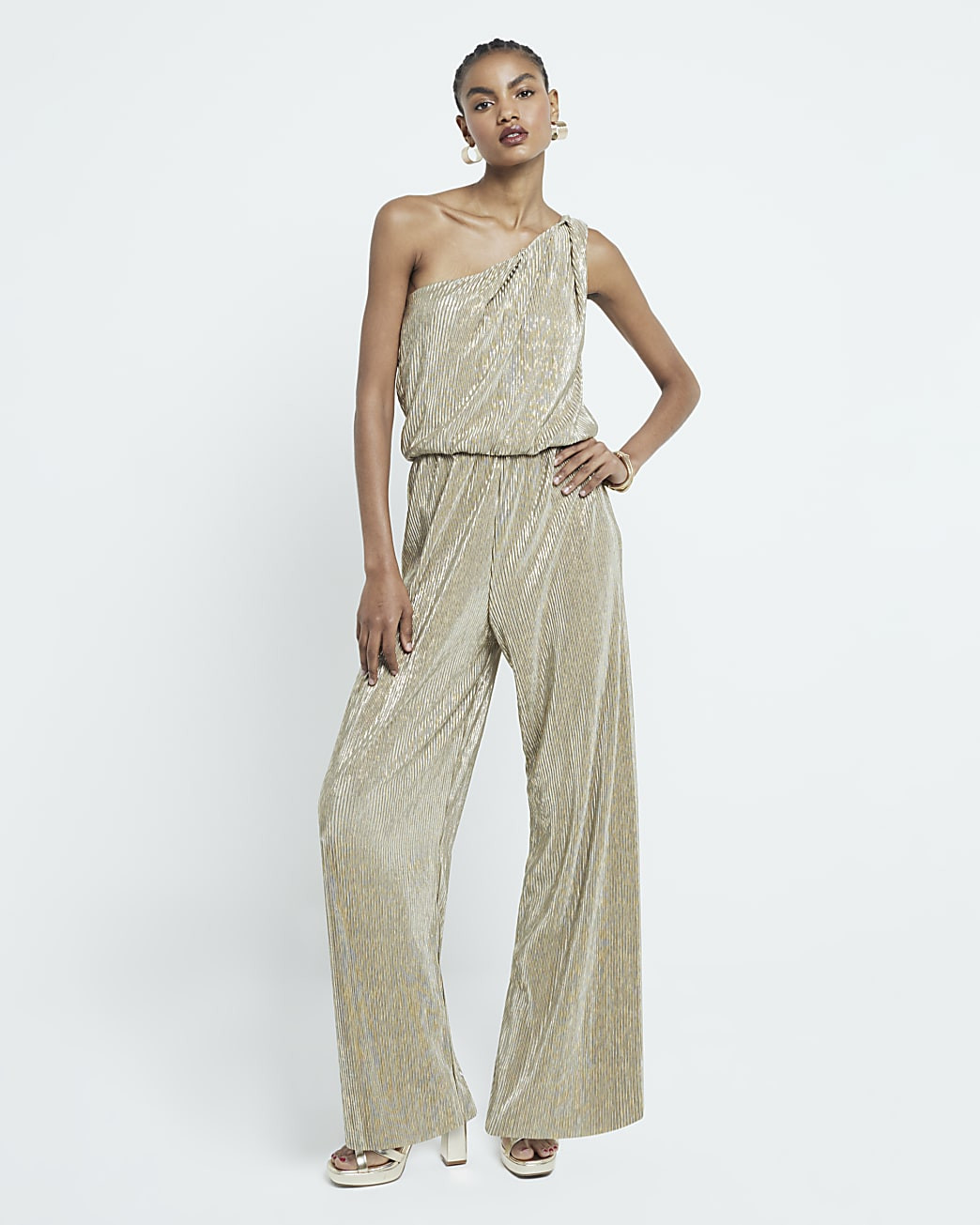 Gold plisse metallic one shoulder jumpsuit | River Island UK & IE
