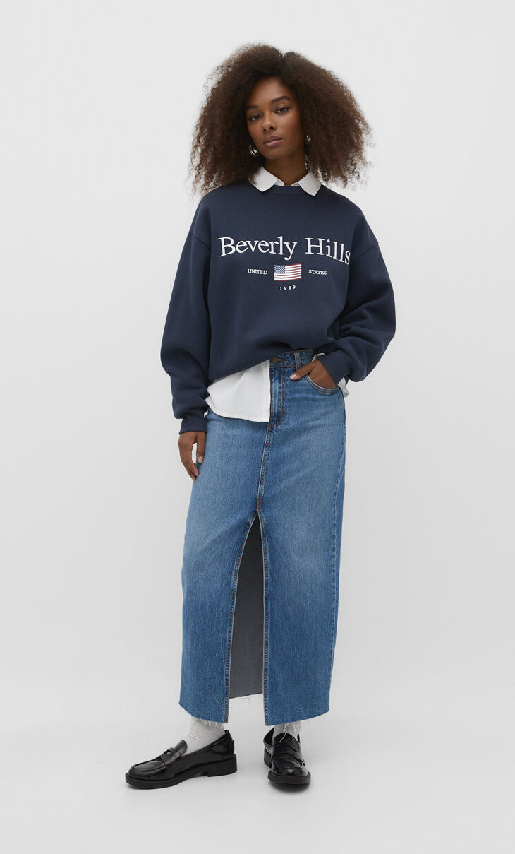 Long straight fit denim skirt with a front slit and seamless hem. Featuring a high waist, comfort... | Stradivarius (UK)