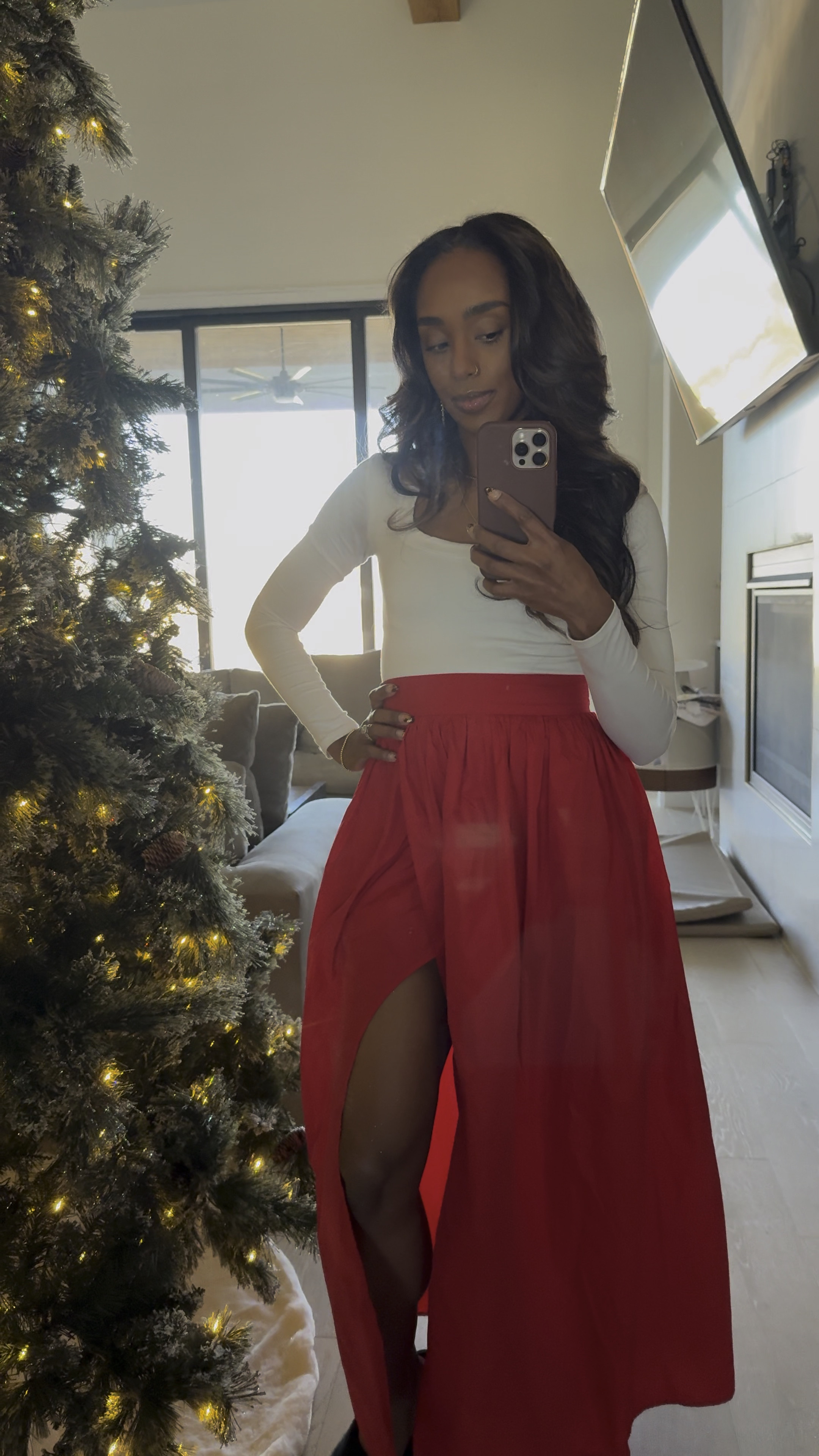 A simple Christmas outfit with a white top and red skirt  

#LTKBeauty #LTKWatchNow #LTKHoliday