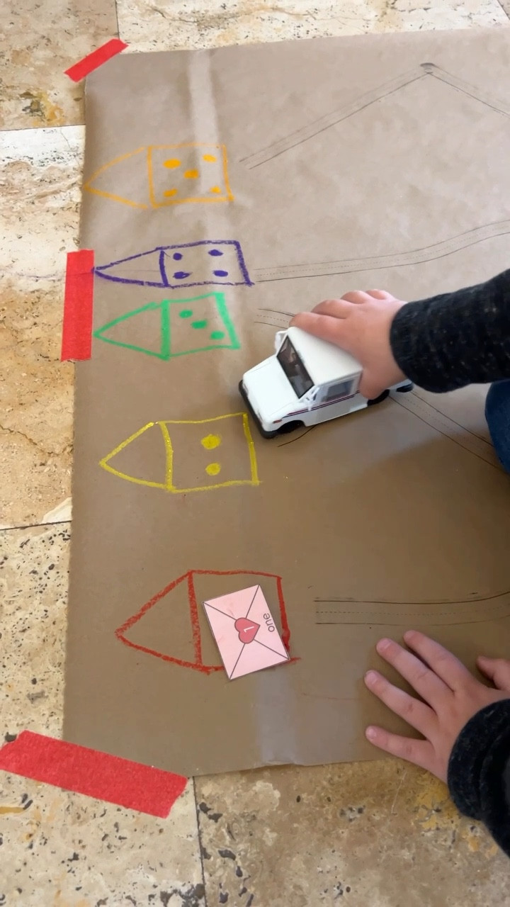 That mail truck though 😍

This Valentine’s mail number match turned into so much more. My son didn’t just stop at the activity—he built an entire town with blocks, added more cars, and extended the play for hours.
The heart number envelopes are from my printable activity pack available at outsidethetoybox.com. The Kraft paper I found at the Dollar Tree but I linked something similar.


#LTKFamily #LTKSeasonal #LTKKids
