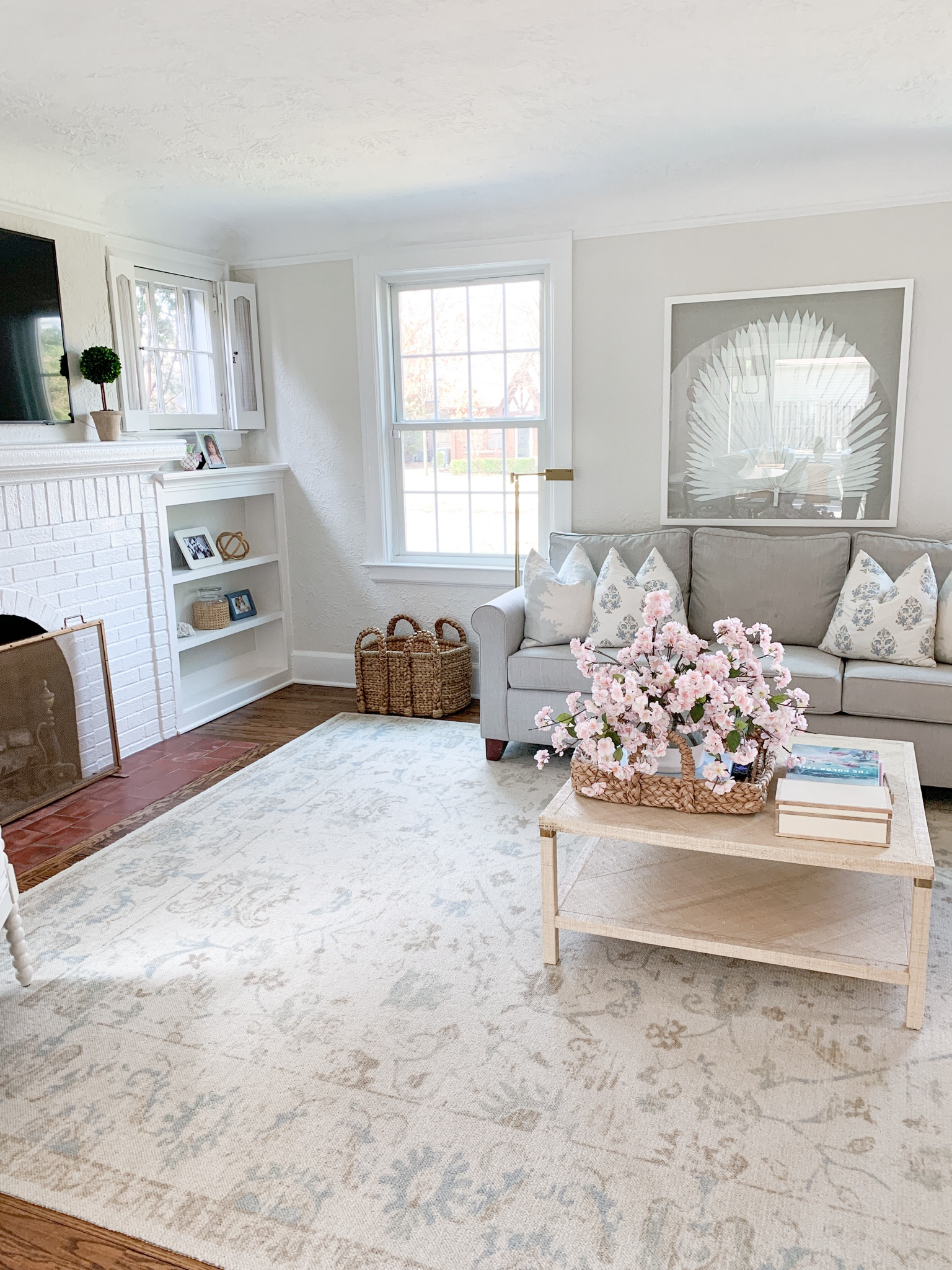 Coastal living room, ivory oushack rug, coastal artwork, bookshelf accessories 

#LTKfindsunder100 #LTKhome