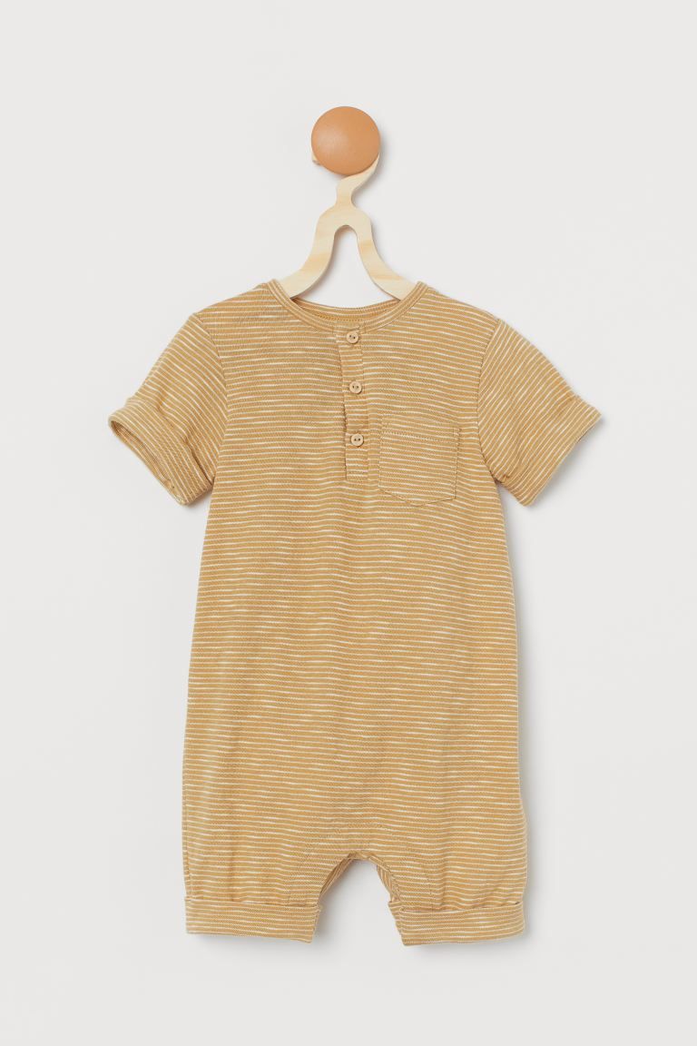 Baby Exclusive. Romper in soft organic cotton slub jersey with a button placket and chest pocket.... | H&M (US + CA)