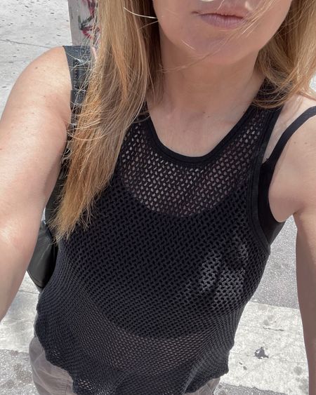 Black fishnet  crochet tank layered over a black crop top that I wore on literally one of the hottest days of the year 🥵 with army green cargo pants and gladiator sandals.

#LTKSeasonal #LTKFindsUnder100 #LTKStyleTip