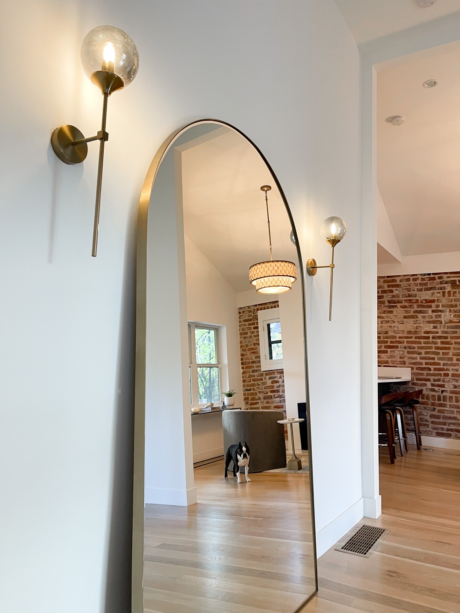 Oversized floor mirror, infinity edge paired with mid mod globe sconces for a unique and modern dining room flare. 

#LTKhome