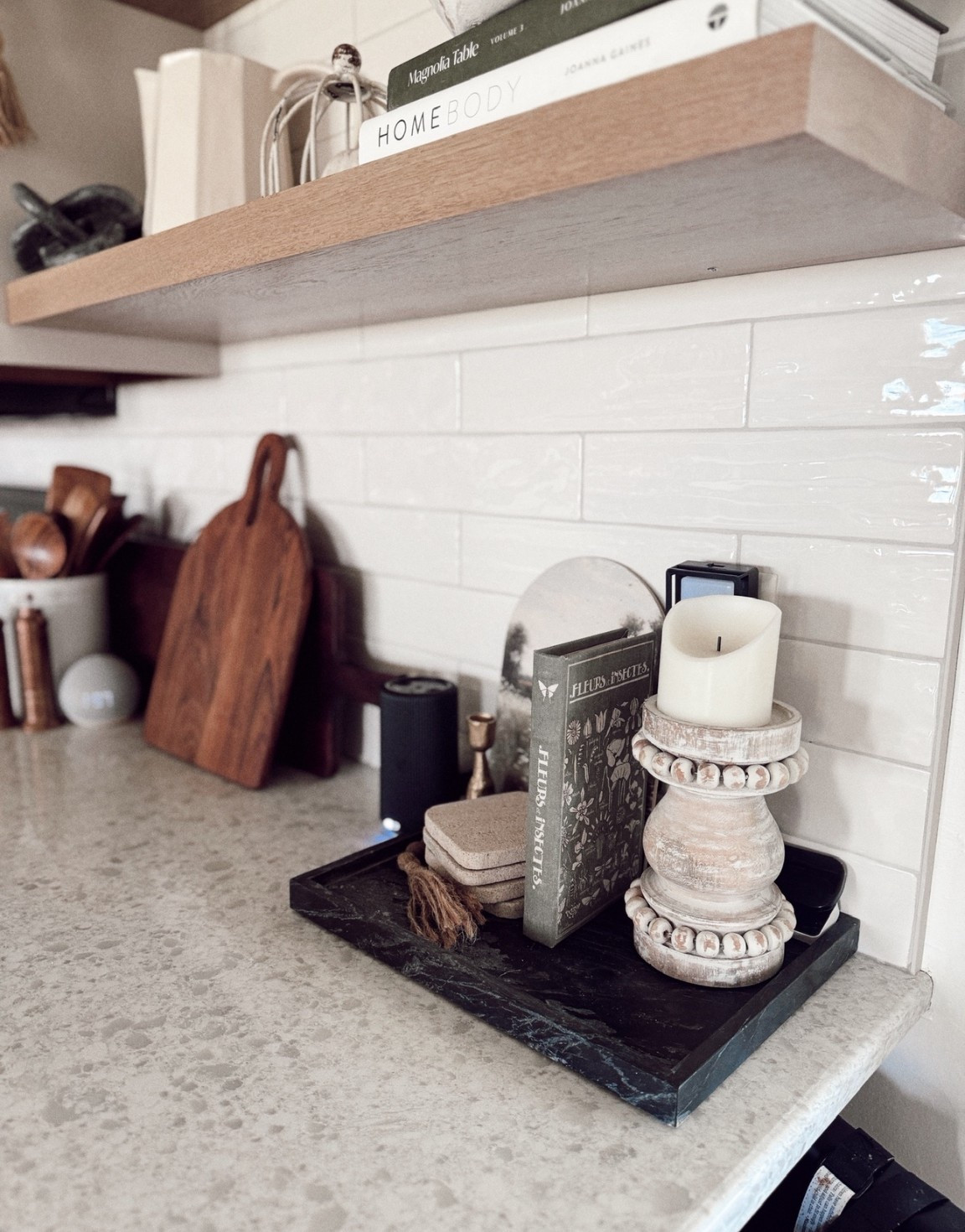 One of my favorite little corners in the kitchen 🤍 This marble tray keeps things organized but still pretty — layered with neutral decor books, coasters, a vintage-style candle holder, and a grounding wood bead accent. Everything’s linked on my LTK! #LTKHome #KitchenStyling #NeutralDecor #TrayDecor #VignetteGoals


#LTKFindsUnder100 #LTKStyleTip #LTKFindsUnder50