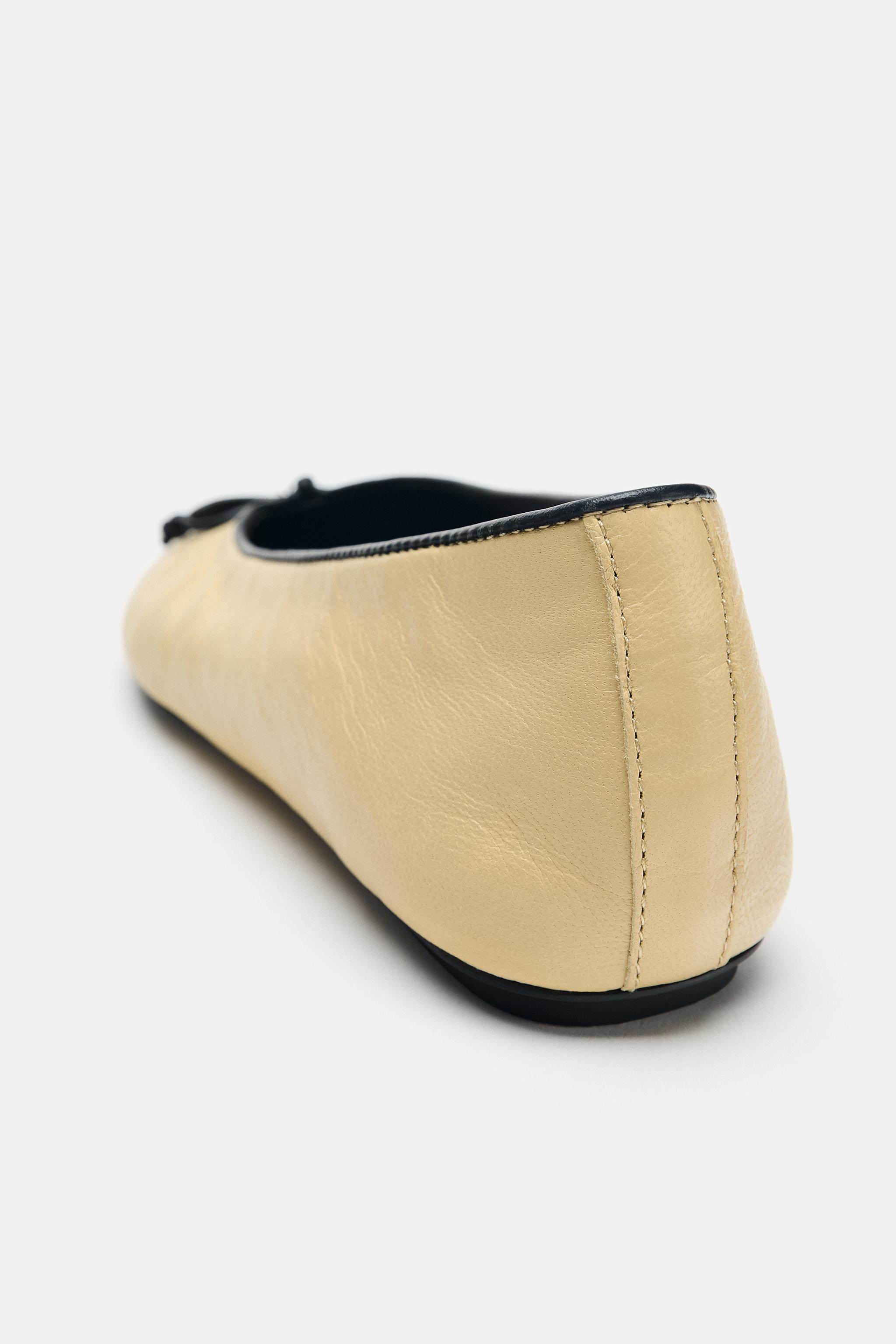 Model height: 180 cmLeather ballet flats. Contrast colour top. Bow and topstitch detail on the fr... | Zara UK