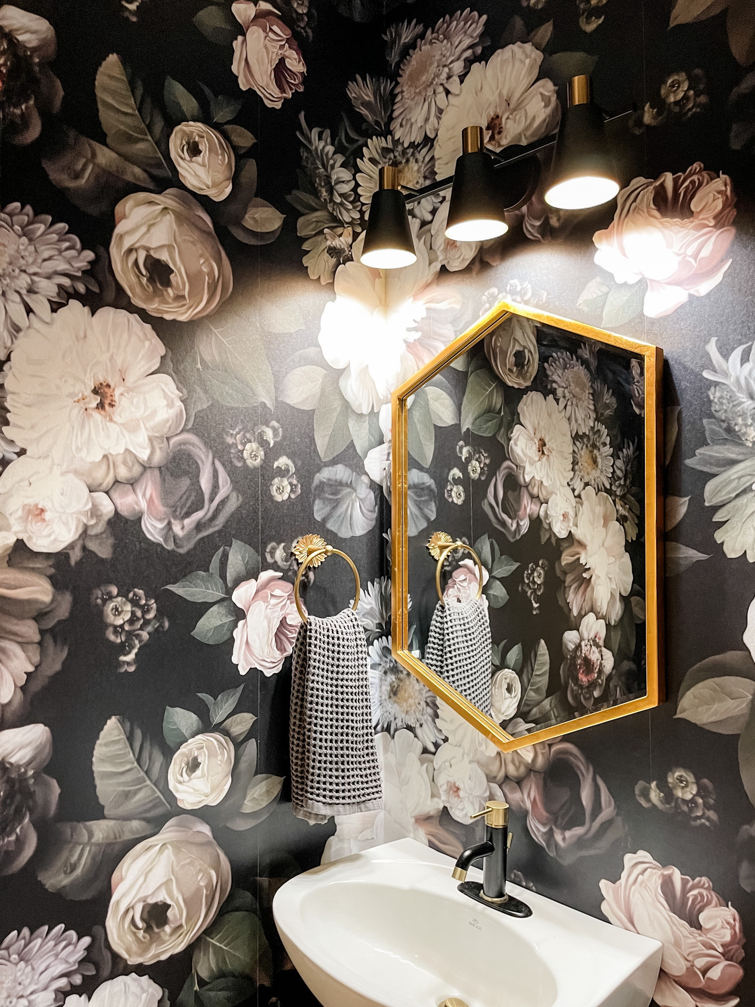 My absolute most favorite wallpaper ever! Moody, large scale floral in perfect harmony with sleek, black and brass accessories. 
#wallpaper #moodyflorals

#LTKhome