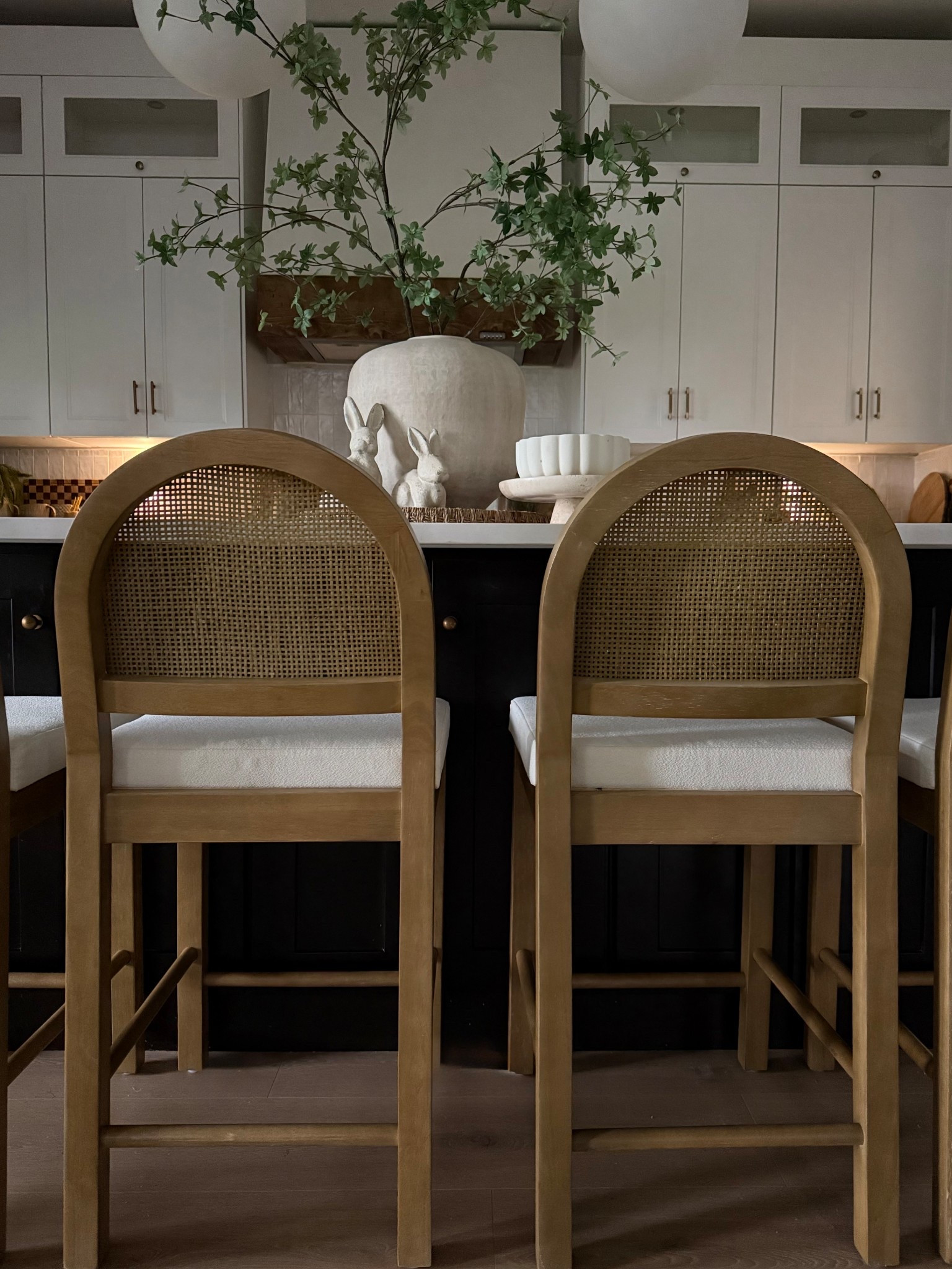 Counter stools…trialing these in our kitchen. And so far so good! Love the details on these…arched cane back, upholstered seat cushion and the warm wood tone.