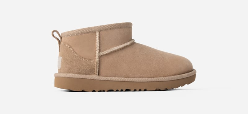 UGG® Kids' Classic Ultra Mini Sheepskin Classic Boots in Sand, Size 1K | UGG (US)