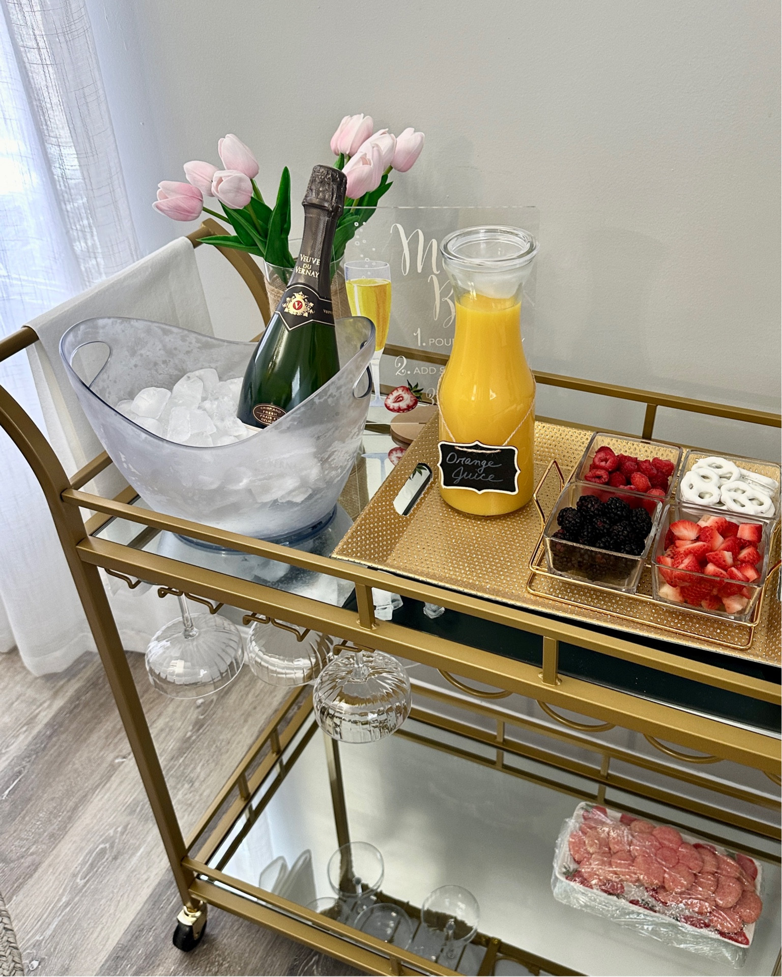 Champagne Mimosa bar cart for brunch, bachelorette parties, baby or wedding showers. Perfect for your home or guests. Faux flower arrangements to match the season.

#LTKParties #LTKWedding #LTKHome