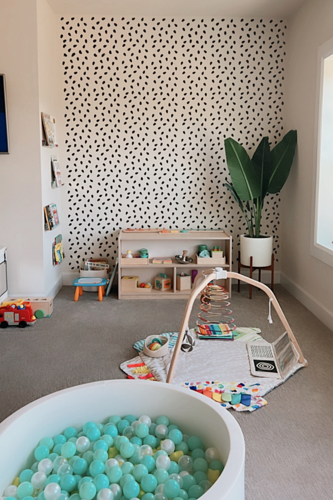 Our playroom for my toddler and infant 🤍
.
#playroom #kidplayroom #playroominspo #toystorage #toyorganization #playroomaesthetic #fakeplant #fauxplant #playmat 

#LTKHome #LTKFamily #LTKKids