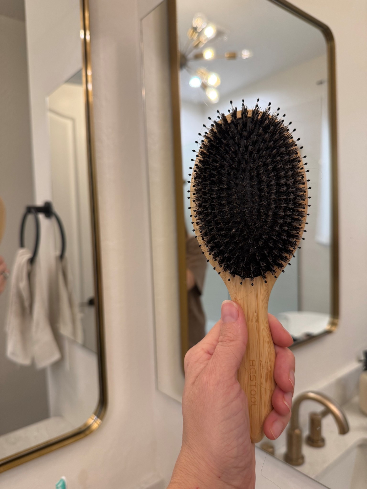 Boars hair brush! 
Best tool to lengthen our hair washing because it distributes oil evenly. 