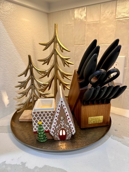 Gold metal Christmas trees, gingerbread wax warmer, black and gold knife set. 

#LTKHoliday #LTKhome
