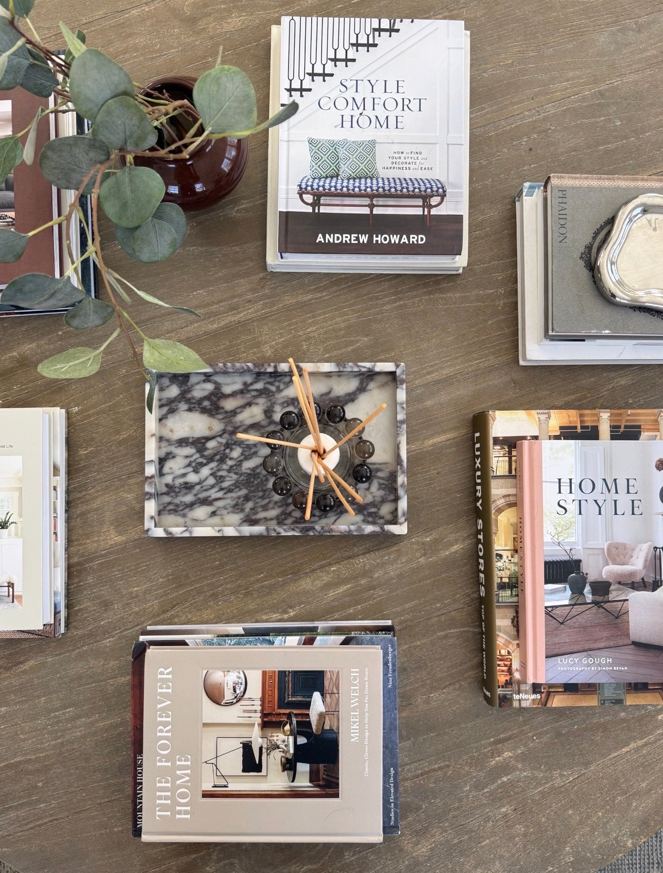 Coffee table books are one of my favorite ways to make a space feel layered and lived in. I love mixing books with collected decor pieces like marble trays, greenery, candles, and little vintage inspired accents to create styling moments that feel effortless but still elevated. These are a few of the design books I reach for constantly, both for inspiration and for adding warmth and texture throughout our home.

coffee table book styling, neutral home decor, marble tray decor, luxury home books, cozy living room styling, designer coffee table books, layered home decor, timeless interior styling, elevated home details, traditional home inspiration, Girl on the Hudson

#LTKSeasonal #LTKHome