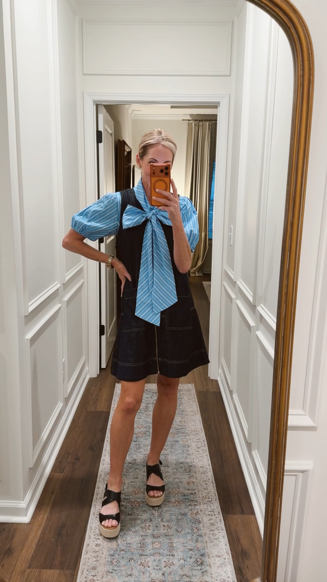 Today’s outfit of the day is this little extra Fun bow blouse that delivers the wow size extra small over this denim classic zip up dress both under $30. Wearing an extra small in both.
