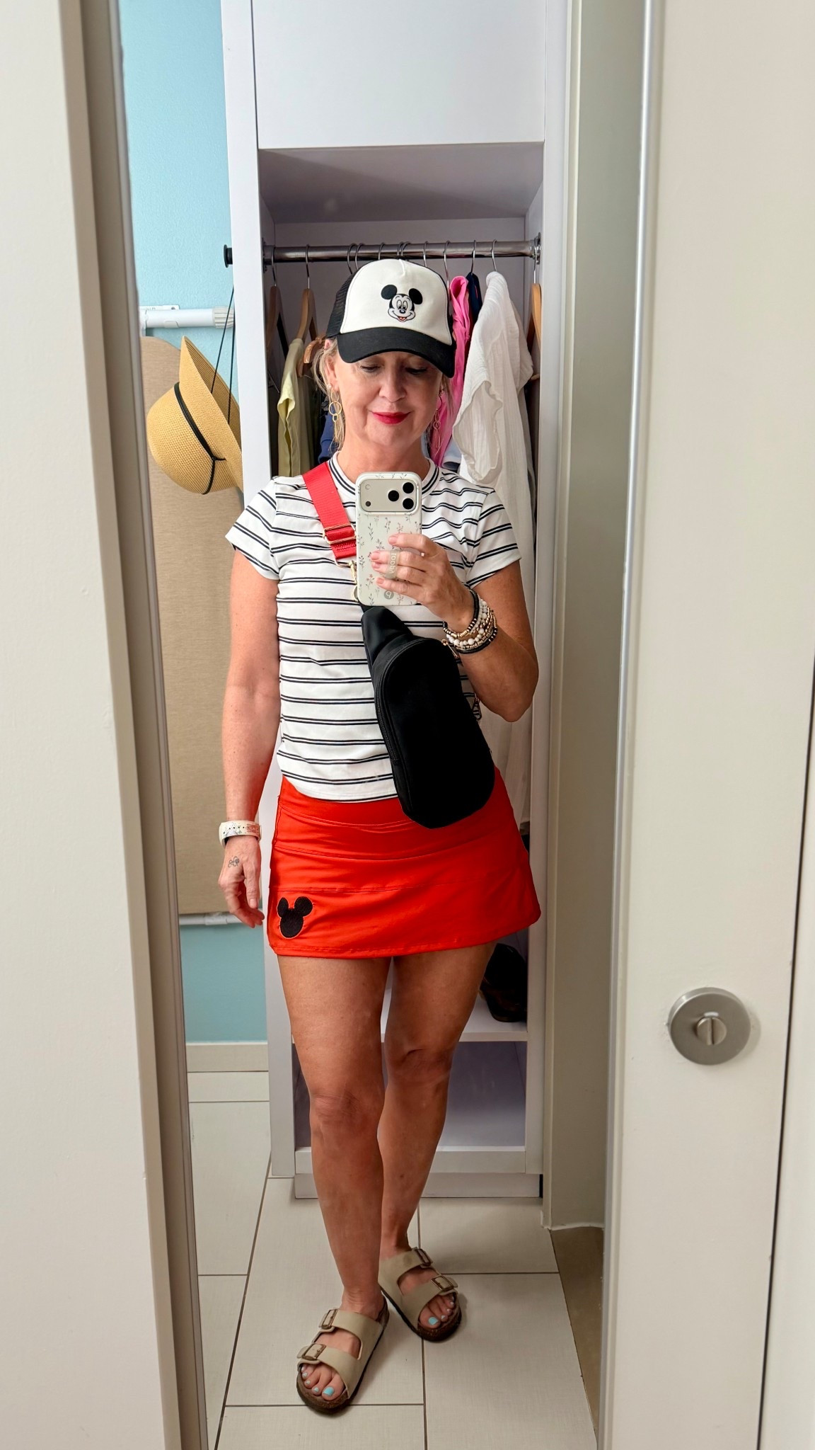 EPCOT day outfit ❤️🐭

This was my EPCOT park day look — comfortable, casual, and perfect for walking the World Showcase all day.

My Mickey skirt from Amazon is one of my favorite Disney pieces (I had the Mickey embroidered on it), paired with a $9 striped tee from Walmart, my favorite Birkenstock dupe sandals from Amazon, and a simple Mickey hat.

An easy Disney park outfit idea that’s cute but still comfortable for long park days.

Everything is linked here.

#disneyoutfit
#epcotoutfit
#disneyparkoutfit
#disneystyle
#disneyootd

⸻

EPCOT Day Outfit ❤️

• Red skirt (Mickey embroidered) — Amazon
• Striped tee — Free Assembly, Walmart ($9!)
• Birkenstock dupe sandals — Amazon
• Mickey hat — Amazon
• Bracelet stack — Amazon
• Belt bag — Hobby Lobby


#LTKOver40 #LTKSaleAlert #LTKootd