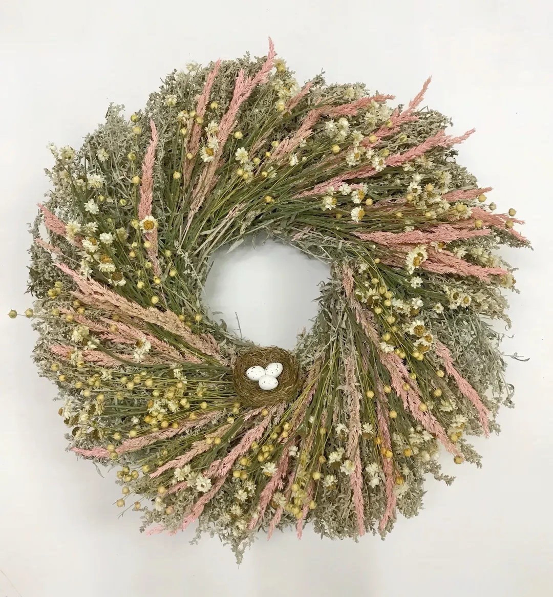 A soft, airy wreath that captures the quiet beauty of early spring 🌿 Layers of silvery artemisia and delicate flax linum create a light, textural base, accented with cheerful ammobium daisies and blush-pink grass. A sweet faux bird’s nest with speckled eggs adds the perfect seasonal touch, making this handcrafted piece feel like a gentle celebration of new beginnings. Grown, dried, and carefully assembled on a U.S. farm, each wreath is truly one of a kind.

#ltkhome #springdecor #driedflowerwreath #farmhousestyle #natureinspired #seasonaldecor #cottagestyle #springhome #rusticdecor #ltkfinds

#LTKSpringSale #LTKSeasonal #LTKHome
