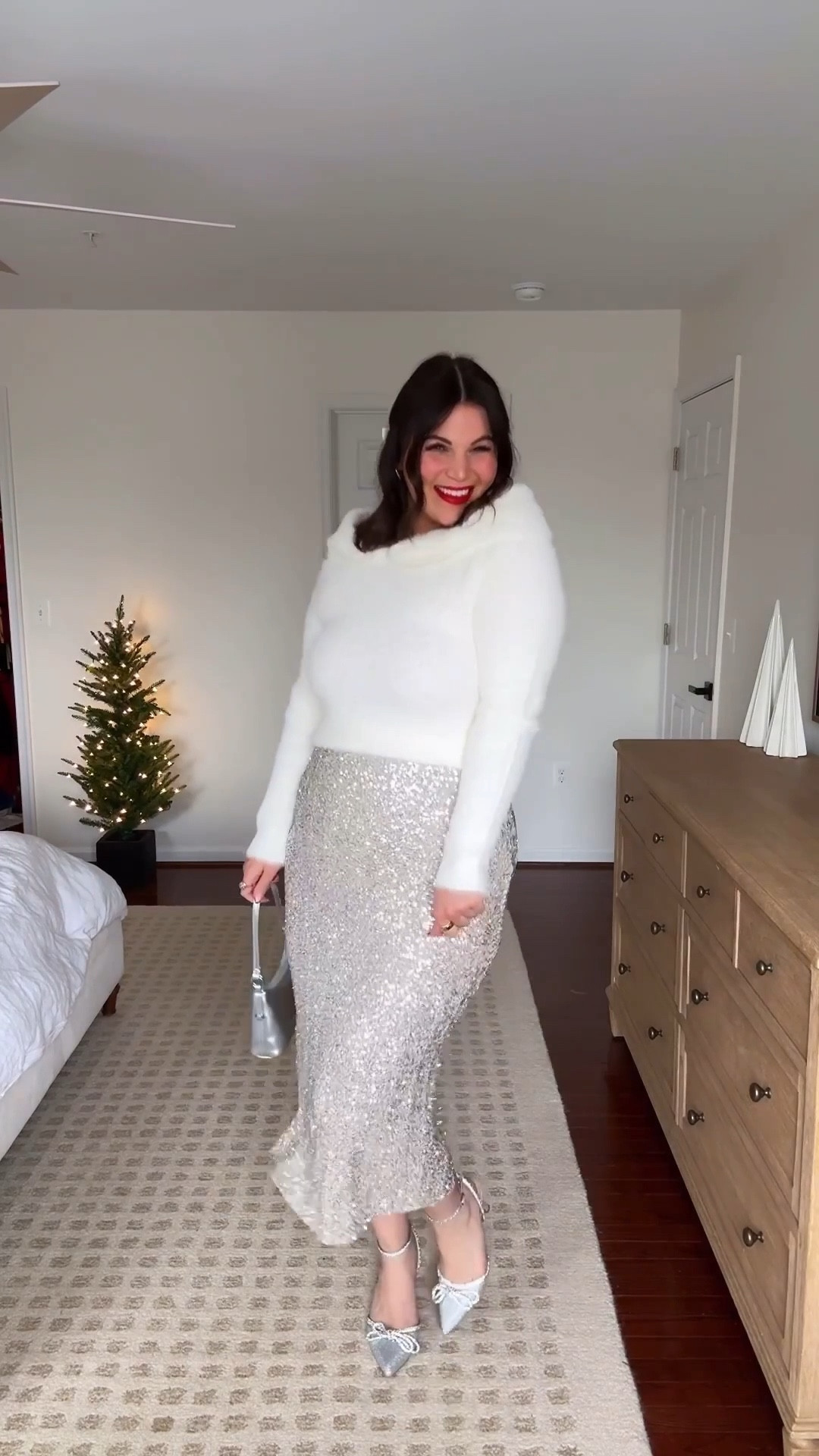 Midsize holiday outfit! You went crazy for this sequin skirt in black so naturally I had to grab the silver as well! And it’s just as good!! 😍 styled it with this white fluffy sweater + some silver accesssories to go with the skirt! You can shop both at @shopbalticborn + use my code KELLY15 to save! 

Strapless -  xl *use code KELLYTK20 to save 
Sweater - xl
Skirt - xl
Heels - 9 
*similar bag



#LTKMidsize #LTKootd #LTKHoliday