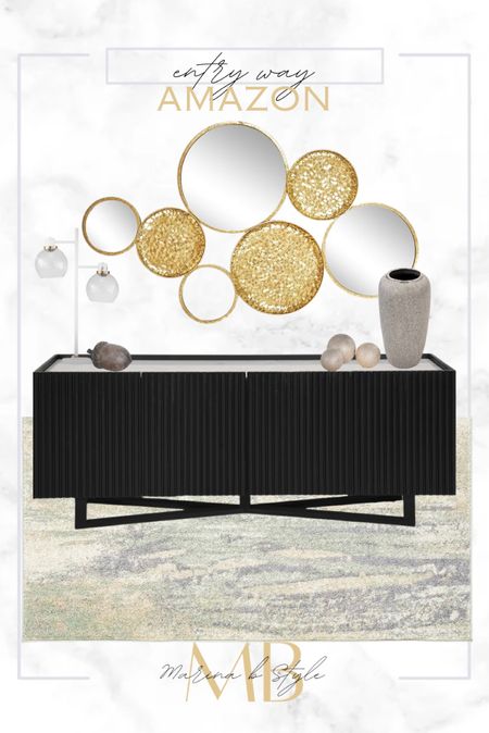 Shop this entry way home design!





Black media stand, console table, gold accent mirror, wall art, vase, large vase, modern lamp, rug

#LTKhome #LTKfindsunder100 #LTKsalealert