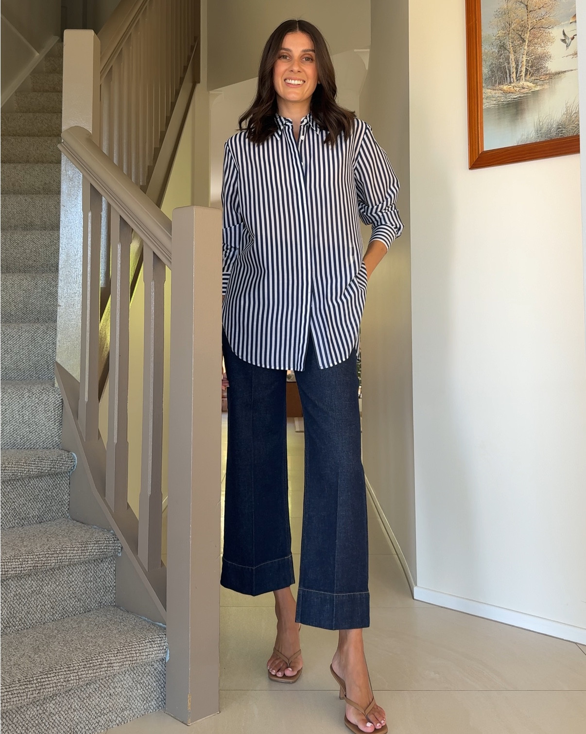 A chic casual outfit featuring dark denim wide leg cropped jeans and a striped cotton oversized shirt that I’ve elevated with a simple tan thong heel. A versatile look that can also be dressed down with sneakers. Jeans and shirt both Saba. Wearing size 10 in the shirt and size 8 in the pants x 