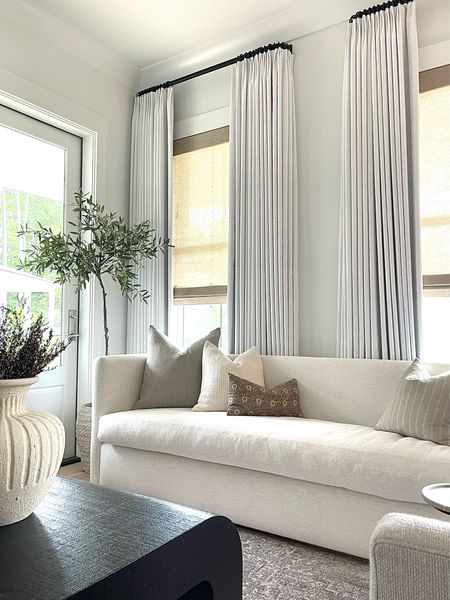 White linen curtains, living room decor, coffee table, coffee table decor, white sofa, sofa pillows, curtain Rod, home decor, floral pillows, linen pillows 

#LTKsalealert #LTKhome #LTKstyletip