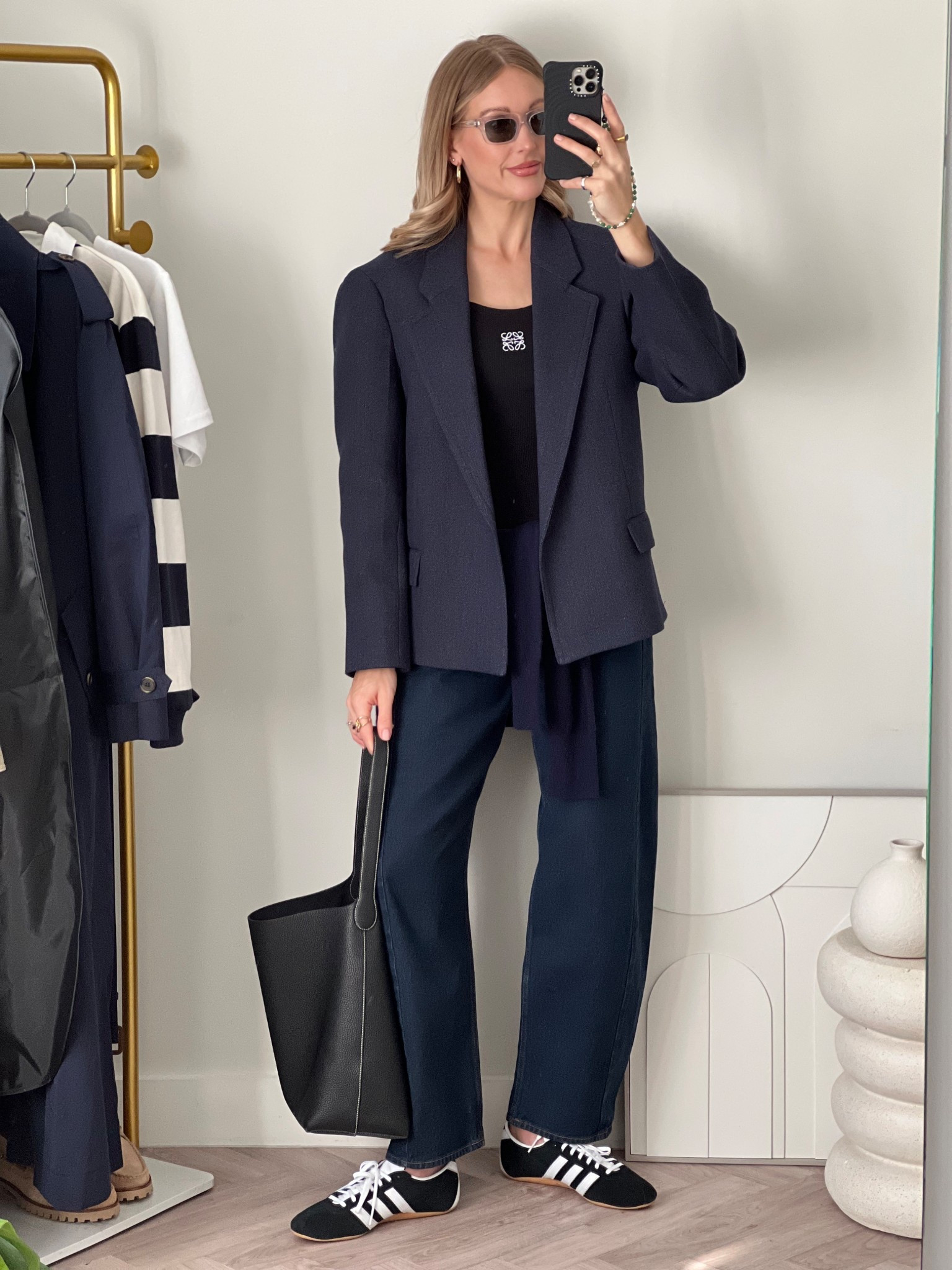 Cos exaggerated shoulder blazer - navy blazer - oversize blazer - barrel leg jeans - adidas Tokyo - trending trainers - trendy sneakers - indigo denim - indigo jeans - clear sunglasses - black phone case - lower vest top - mum outfit - smart casual - trainers outfit - spring outfit - Abercrombie jeans - Taylor morris 

#LTKAprilSpotlight #LTKspring #LTKuk