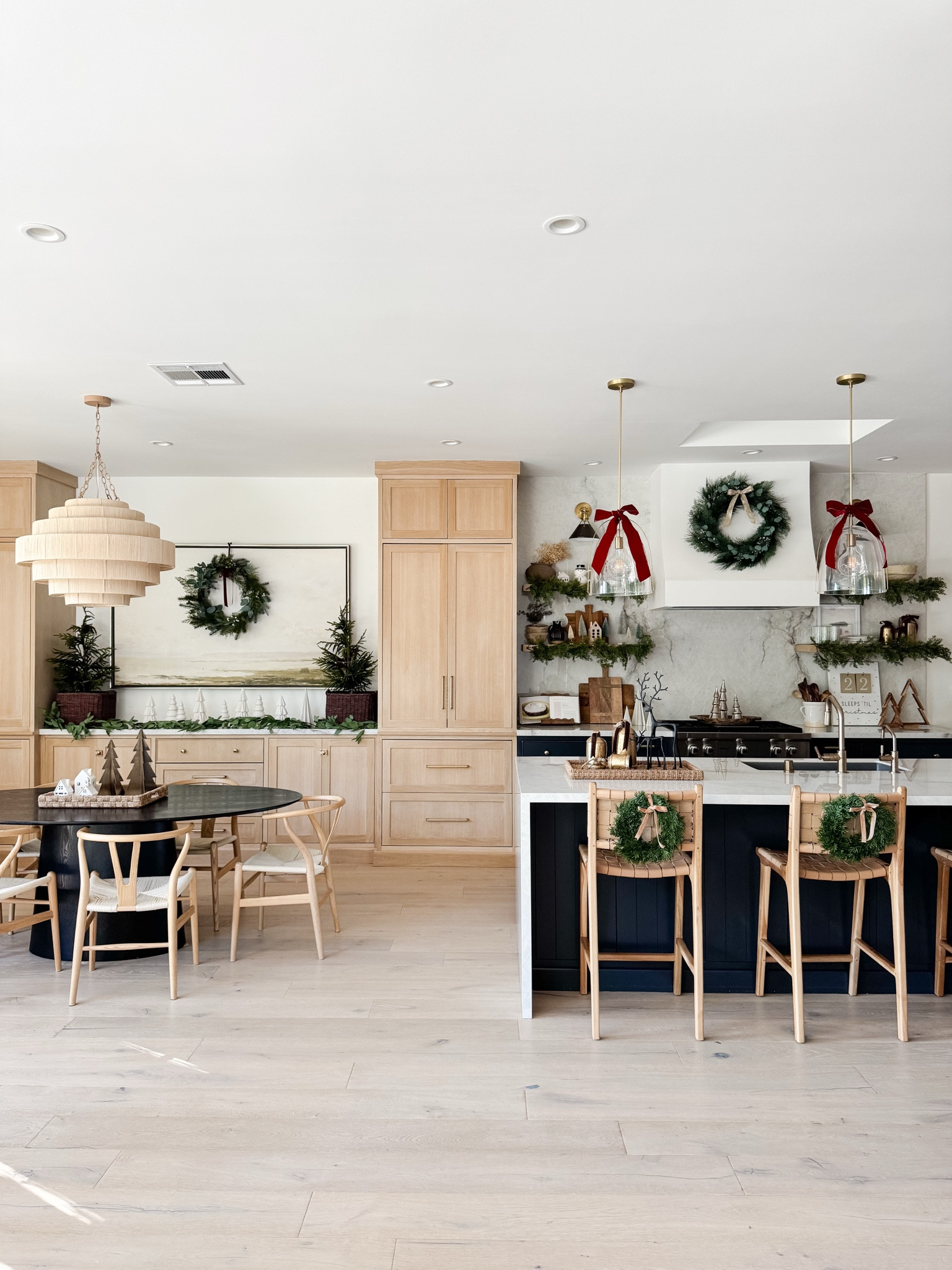 Holiday decor in our kitchen. Wreath, barstool, leather, braided, red ribbon, maroon garland, wishbone chair, black, oval, dining table, tan chandelier, modern art, reindeer. Amazon Wayfair counter stool Hati Target basket 

#LTKFindsUnder100 #LTKSaleAlert #LTKHome