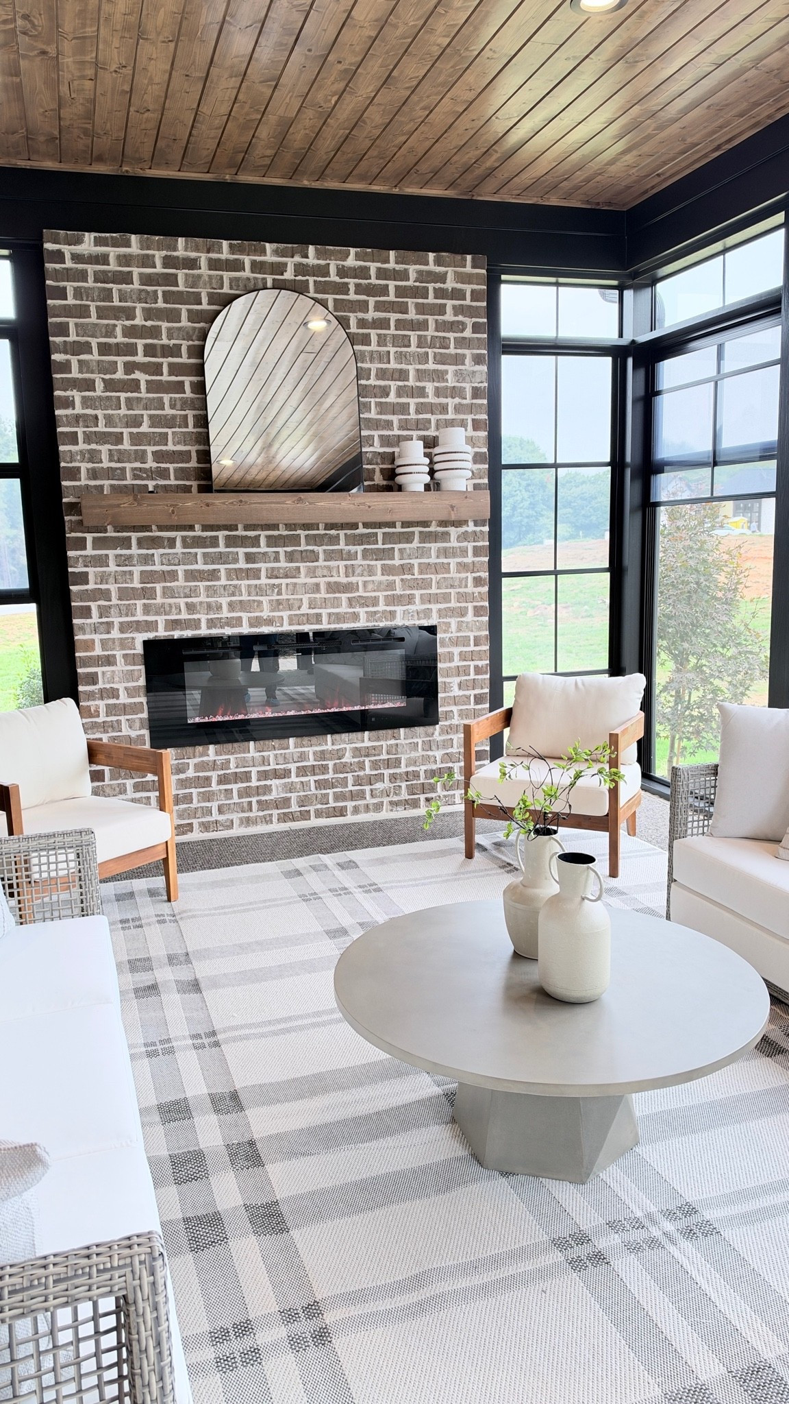 Loved this porch set up. Found some similar items online for the chairs, mirror, rug, and vases.