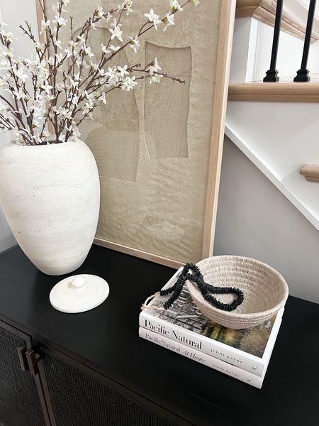 Spring home decor, spring entryway, home decor, neutral spring decor, organic modern home decor, entryway styling, cane console, black console table, black cabinet, entryway cabinet, ceramic bowl, spring stems, faux florals, target home decor 



#LTKhome #LTKfindsunder50 #LTKSeasonal
