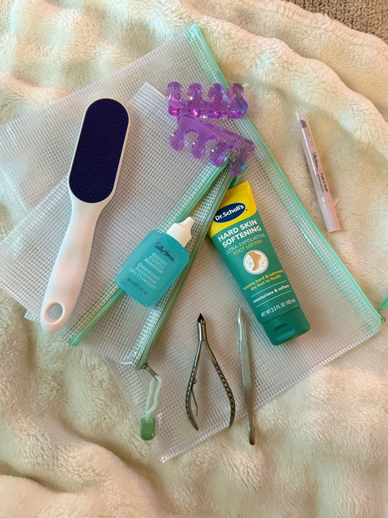 At-home pedicure essentials.

I’ve slowly put together a little at-home pedicure kit with the tools and products I actually reach for between salon visits and almost everything lives together in mesh zipper pouches so I’m not hunting through drawers when I need something.

My Amazon pedicure essentials:

• Sally Hansen Classic Cuticle Nipper + Pusher
• Toe separators
• Sally Hansen Push & Buff 2-in-1 Cuticle Care Treatment Pen
• Sally Hansen Instant Cuticle Remover
• Dr. Scholl’s Hard Skin Remover Nano Glass Foot File
• Dr. Scholl’s Hard Skin Softening Ultra-Exfoliating Foot Lotion
• Mesh zipper pouches for keeping everything organized

Perfect for maintaining your pedicure at home, doing a full polish change, or giving your feet a little extra TLC between appointments.

Save this list for your next at-home pedi night.

#LTKdayinmylife #LTKTravel #LTKselfcare