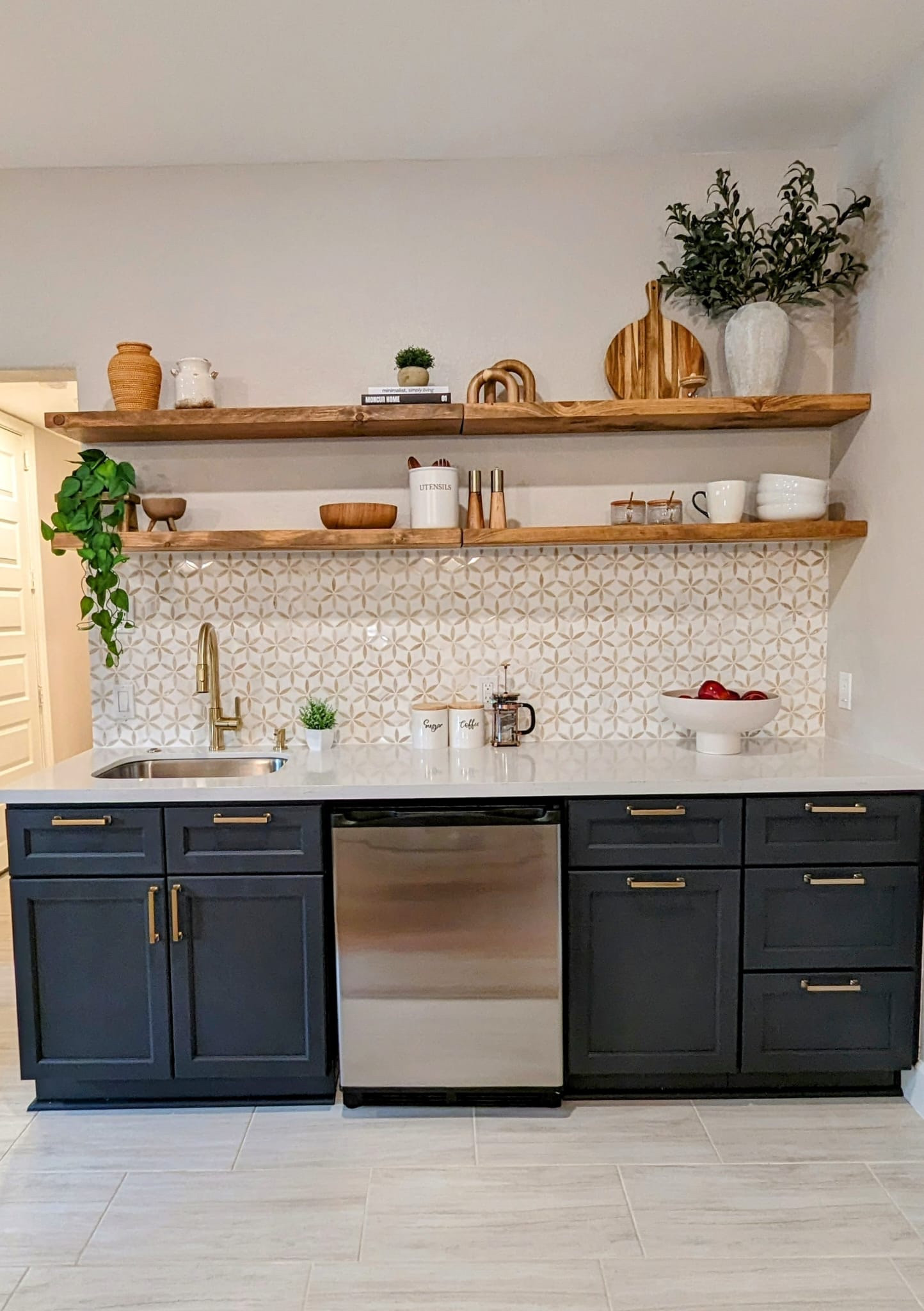 Perfect blend of style and function in this kitchen space. 
Navy cabinets with golf hardware, wooden open shelving make this a kitchen goals, modern and rustic 

#LTKhome #LTKstyletip