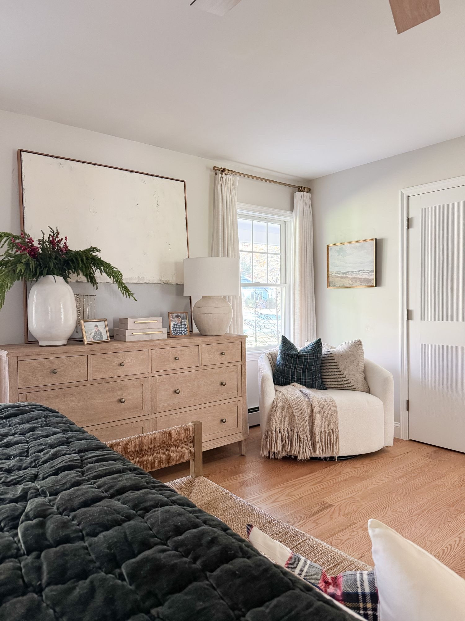 A cozy reading nook and styled dresser add softness and balance to this serene winter bedroom. Warm woods, soft lighting, and layered textiles give the space an inviting coastal feel. Winter bedroom, coastal bedroom decor, bedroom reading nook, neutral bedroom, cozy winter decor, coastal home, wood dresser, soft lighting, modern coastal bedroom, bedroom corner styling, Sherri Calnan Home

#LTKSeasonal #LTKHome #LTKHoliday