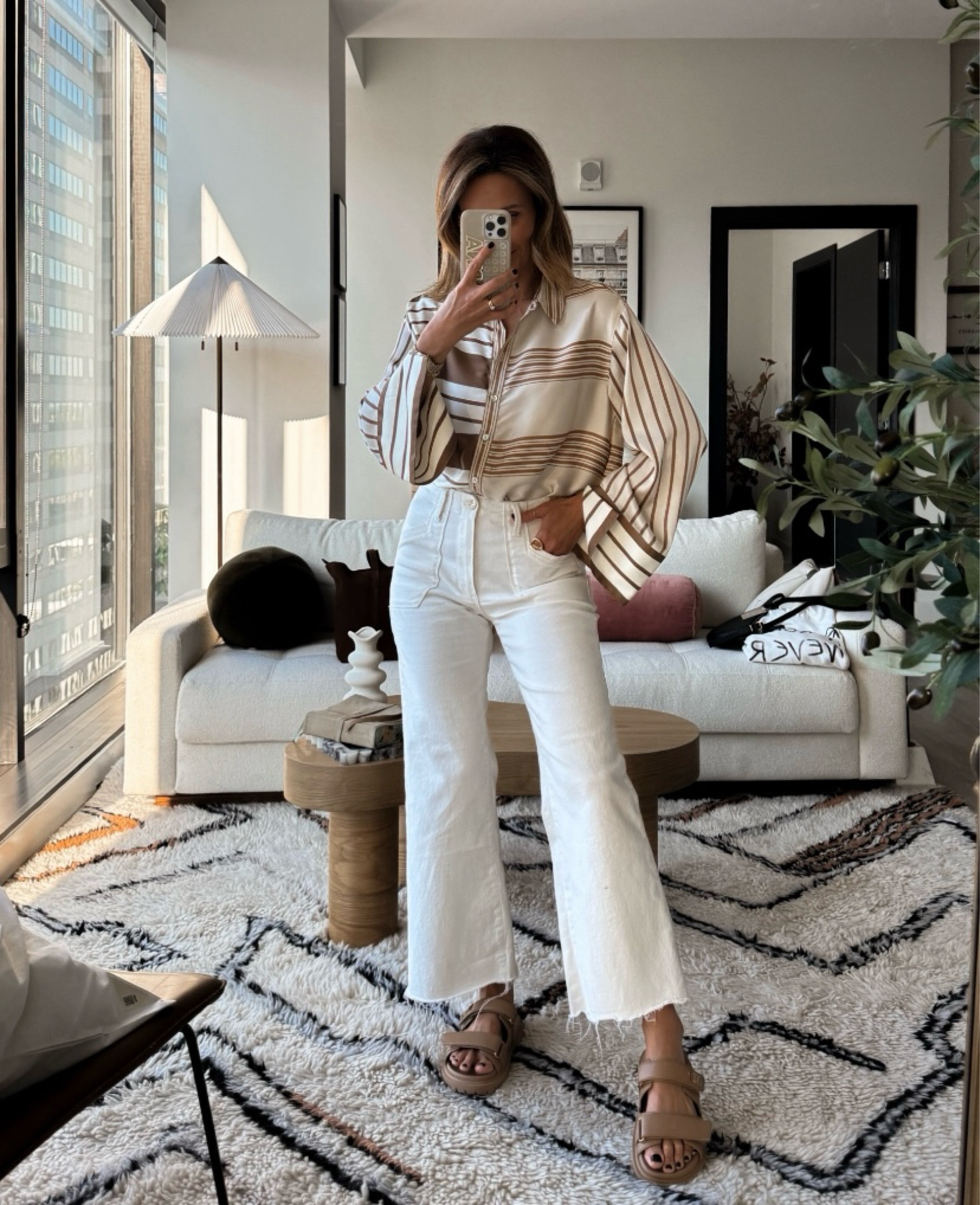 This was my go-to end of summer look, but it just so happens to work perfectly as a fall outfit too! White jeans offer a fresh change up from your typical denim, and this pair is ultra comfy and timeless. Style it with a silky striped blouse to make a subtle yet chic statement. I’m wearing both pieces with chunky sandals here, but I think tan loafers or metallic ballet flats would also look cute! 

#LTKShoeCrush #LTKStyleTip #LTKFindsUnder100