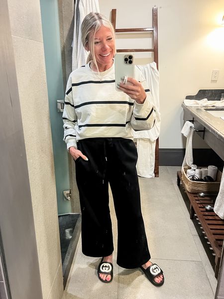 Love these black wide leg pants with the striped Lululemon sweatshirt. Size 4 in the sweatshirt and size small in the pants which come with a matching black top. Travel outfit 

#LTKTravel #LTKStyleTip #LTKOver40