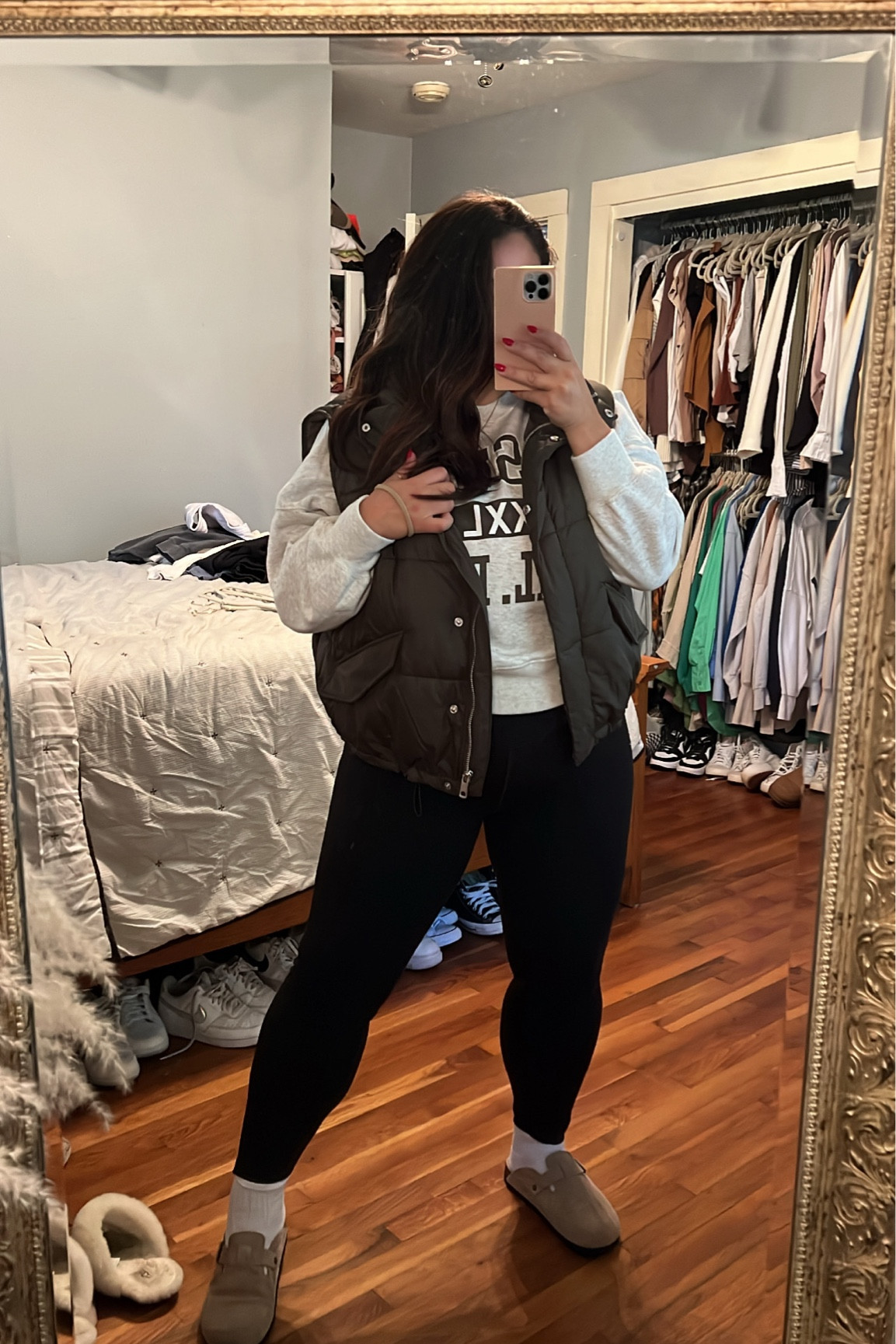 Green puffer vest, graphic sweatshirt, white crew socks, Birkenstock dupes, Birkenstock Boston clogs, black leggings, comfy outfit. Fall outfit inspo 

#LTKstyletip #LTKfit #LTKSeasonal