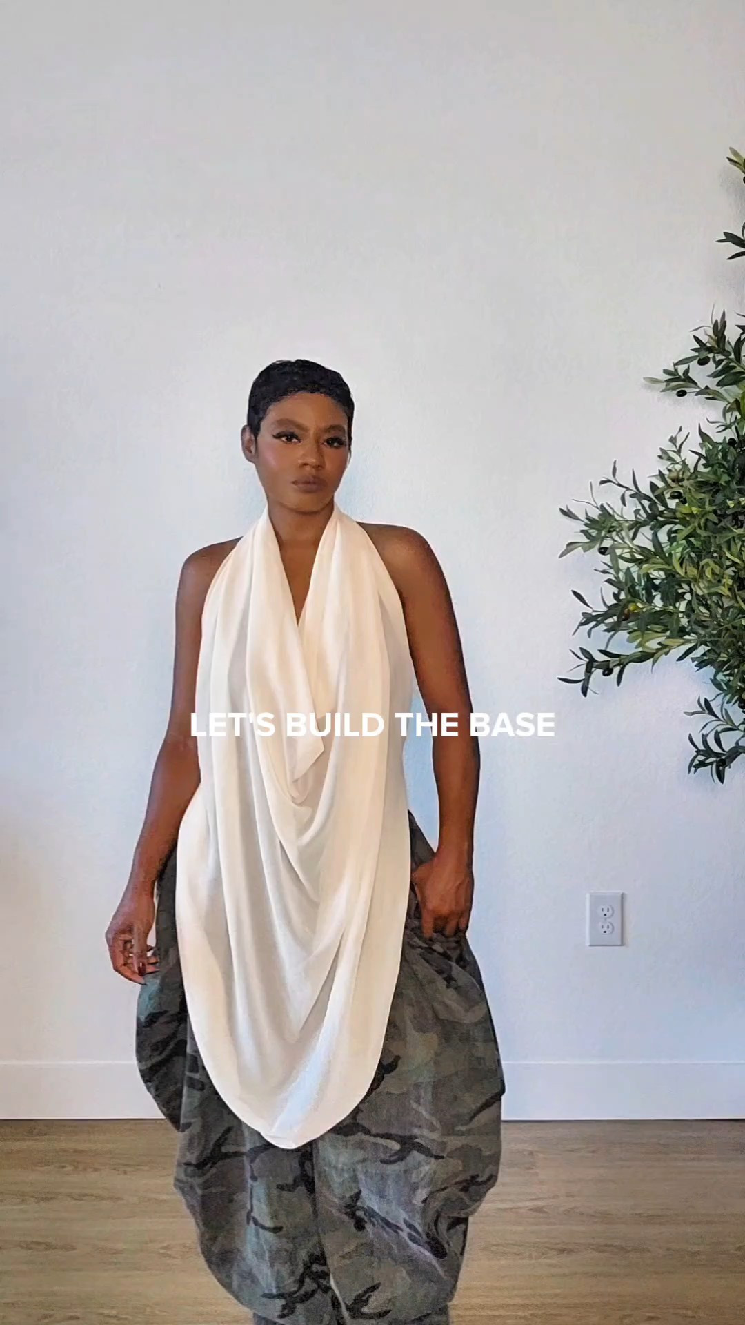 Fall Transition Streetwear Outfit | Casual & ChicThis casual streetwear look is giving me all the fall transition outfit vibes.. baggy camo pants, a draped halter top, and a little edge. Easy, relaxed, but still put together.

#LTKgrwm #LTKPetite #LTKootd