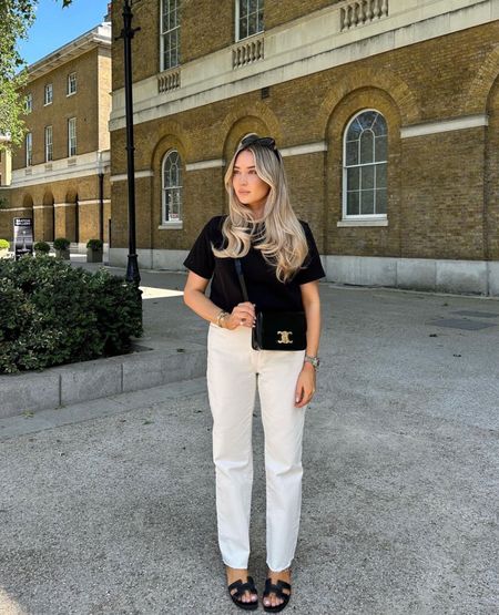 Monochrome Spring Look, Cos black tee, cream off white neutral jeans, Hermes Oran black leather sandals and Celine Triomphe Bag

#LTKshoecrush #LTKstyletip #LTKSeasonal