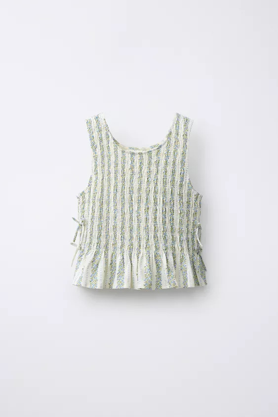 Round neck top with straps. Bow appliqué at sides and ruffle hem. | Zara US