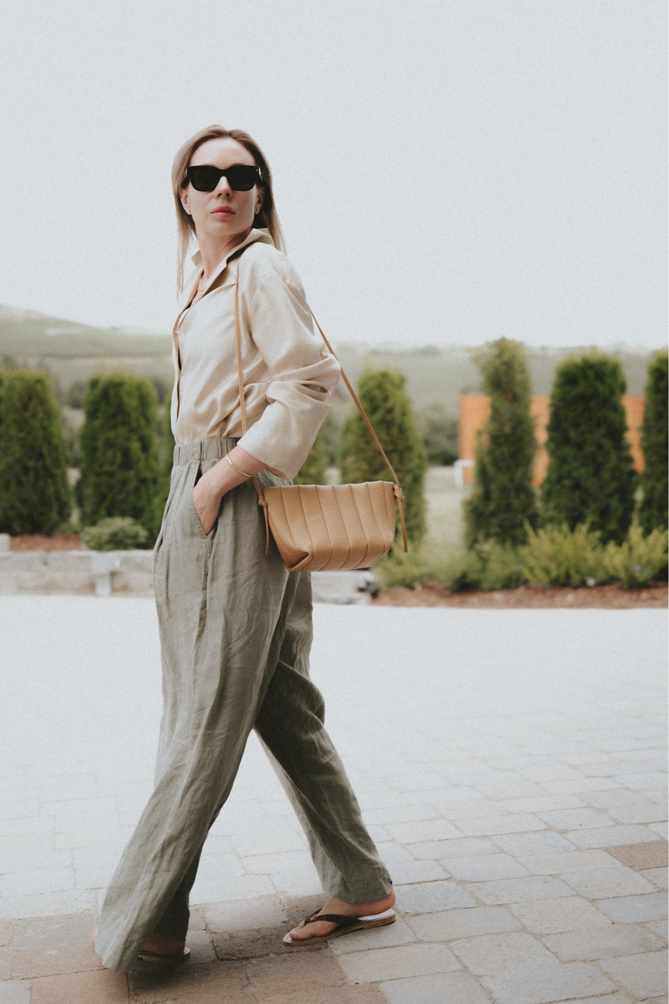 Chilly mornings & hot days: long sleeves and loose natural fabrics. 
@Lily Studio silk shirt 
Sandals by K. Jacques St. Tropez
Bag: Maeden
Pants: very old linen pants by OYSHO, similar linked

#LTKootd #LTKSeasonal #LTKWorkwear