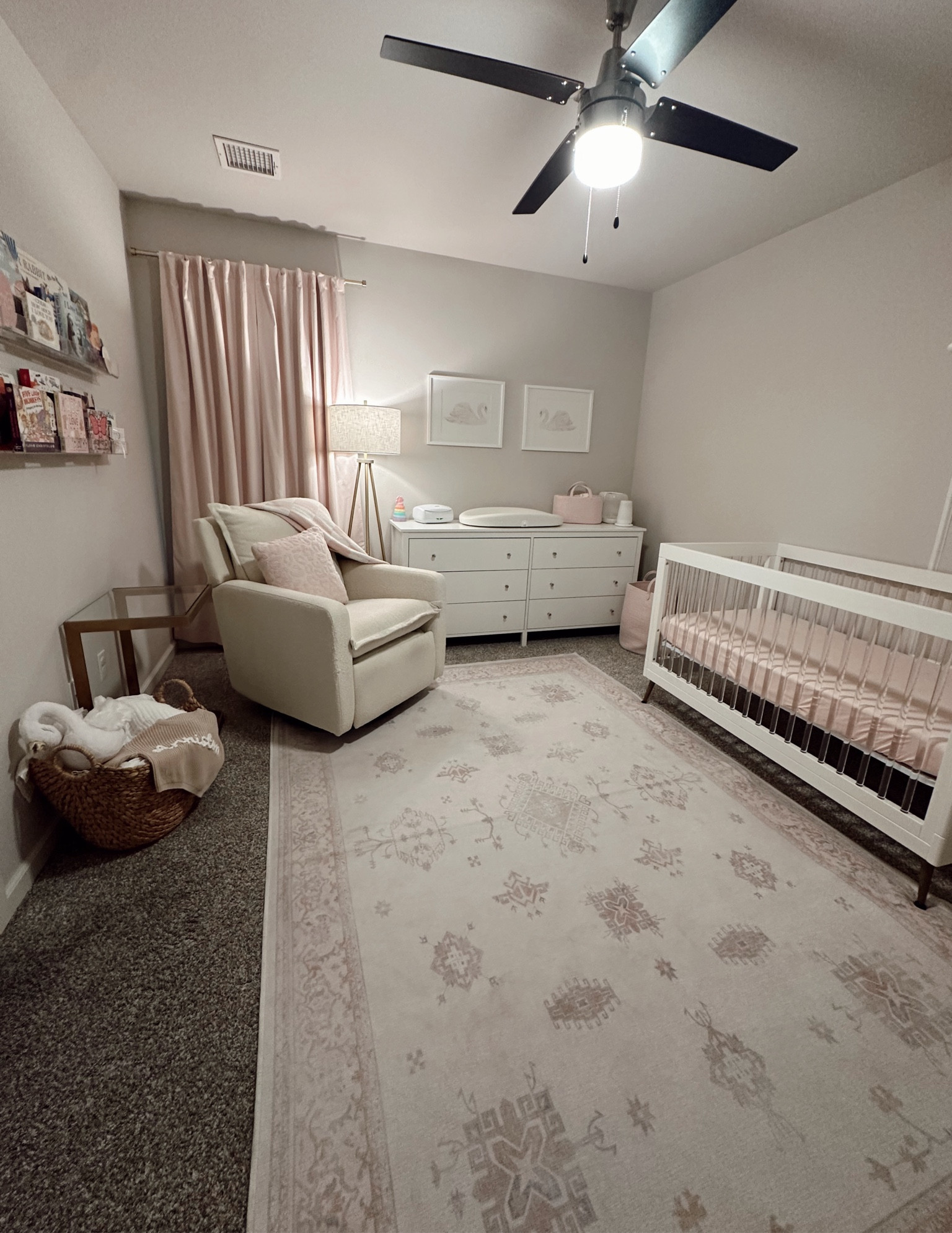Baby girl nursery Inspo #acryliccrib #crib #pinkrug #nurseryrug #bookshelf #pinkcurtains #nurserycurtains #babygirlroom #nurserywalldecor #swandecor #babypinknursery #pinkdecor 