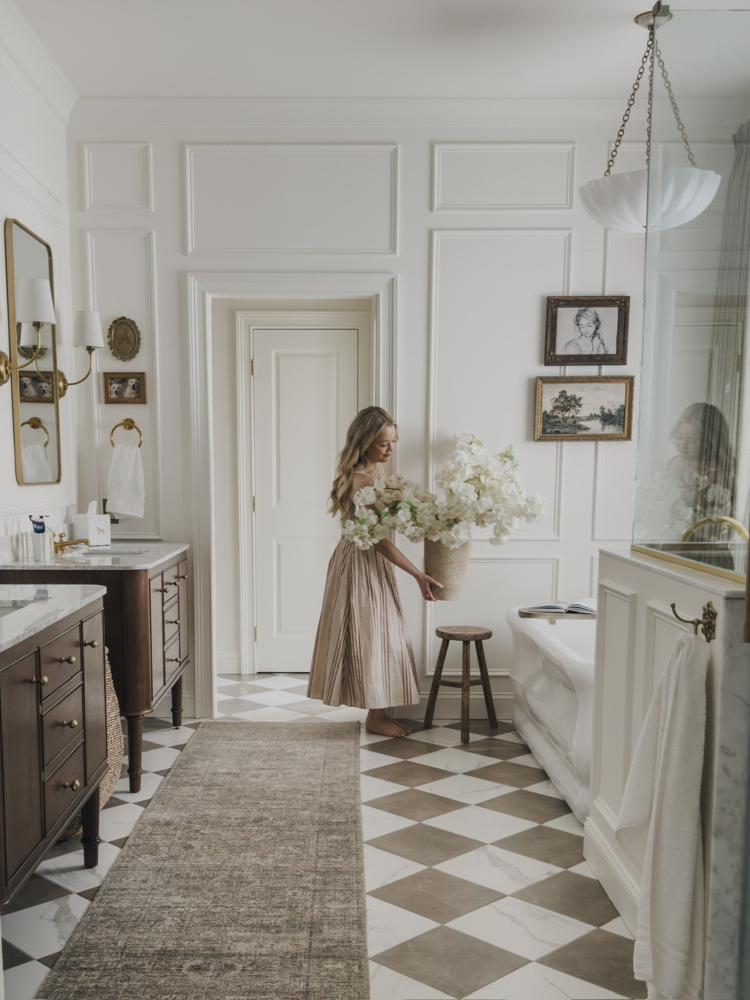Timeless primary bathroom details! Loving these bright and full cherry blossoms for summer with an added layer into my collected and classic bathroom space.

Home finds, neutral home inspo, collected style, primary bathroom inspo, checkered flooring details, vintage inspired area rug, vanity details, wainscoting details, brass detail, statement lighting, freestanding tub, vintage style stool, faux florals, Wayfair, Perigold, Amber Lewis, Loloi, Home Depot, Afloral, Abercrombie, Anthropologie, shop the look!

#LTKSeasonal #LTKHome