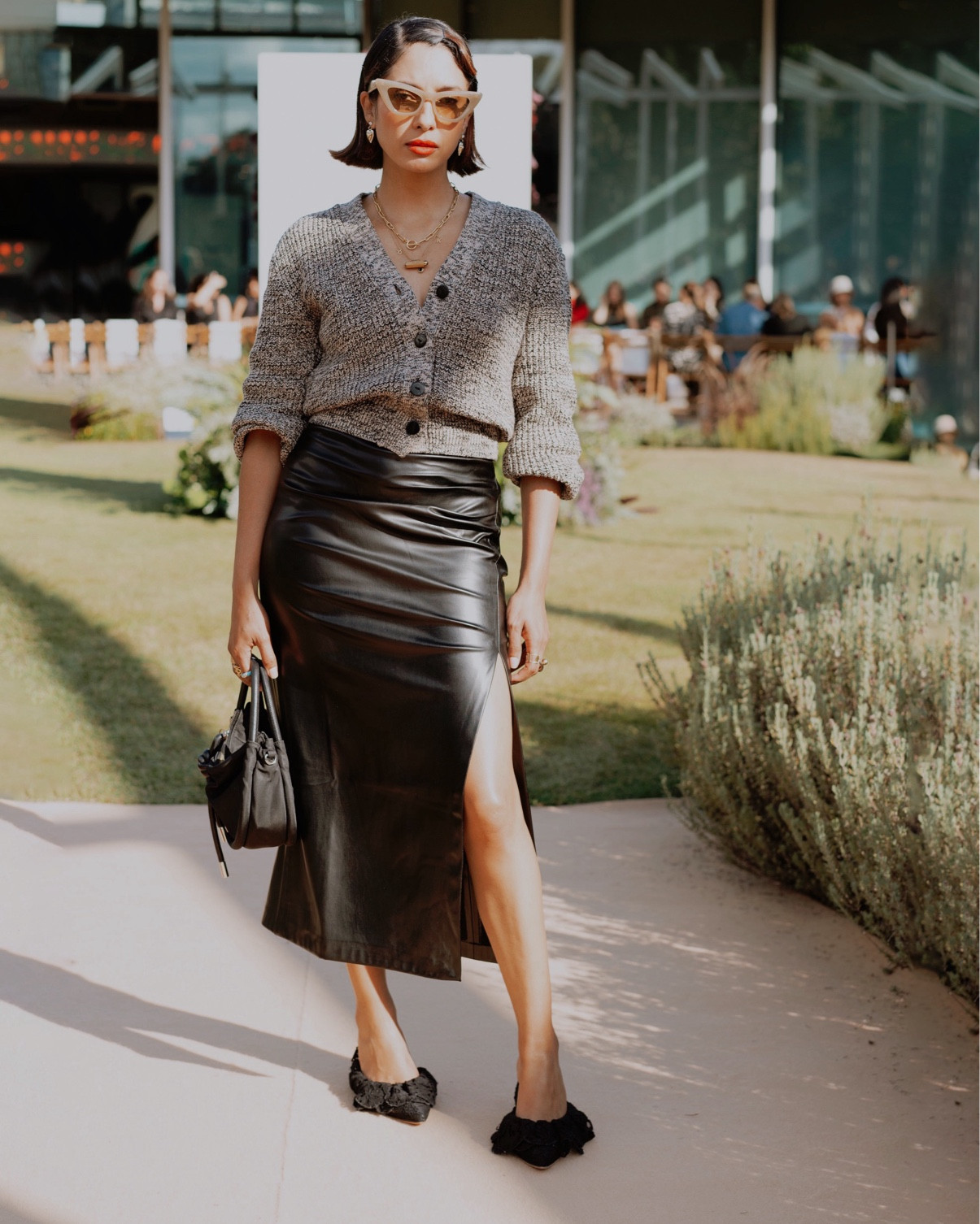AUSTRALIAN FASHION WEEK LOOK 

showpo faux leather midi skirt, H&M wool blend cardigan, Brother Vellies mules, Ganni bag, Banbe sunglasses 

#LTKwinter #LTKstyletip #LTKworkwear