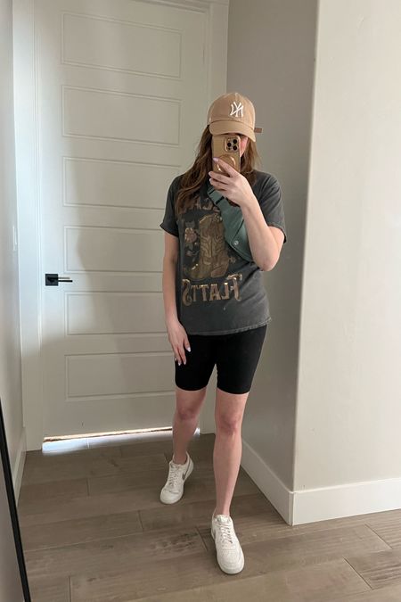 Biker short outfit with hat. Biker shorts outfit black. Biker shorts outfit with sneakers. Casual outfit idea. Spring outfit idea. How to style black biker shorts for spring. Rascal flatts graphic tshirt. Forever 21 oversized shirts. Sneakers outfit. Over 40 outfit  

#LTKunder50 #LTKFind #LTKstyletip