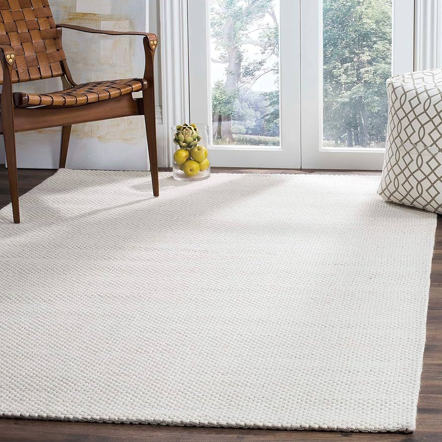 SAFAVIEH Natura Collection Area Rug - 6' x 9', Ivory, Handmade Solid Wool, Ideal for High Traffic... | Amazon (US)