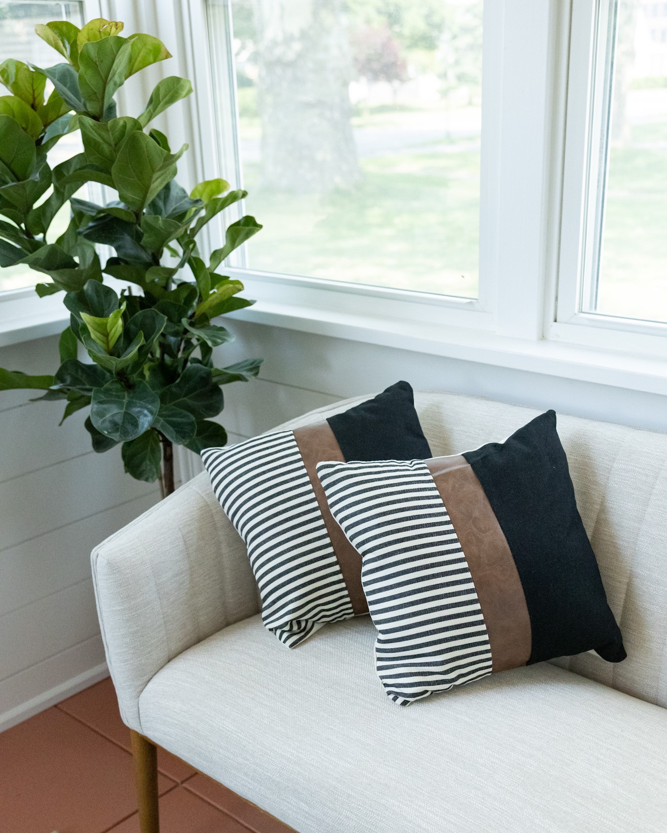 Cozy sunroom corner with fiddle leaf fig tree, neutral loveseat and accent pillows. 🌿


#LTKFind #LTKunder100 #LTKhome